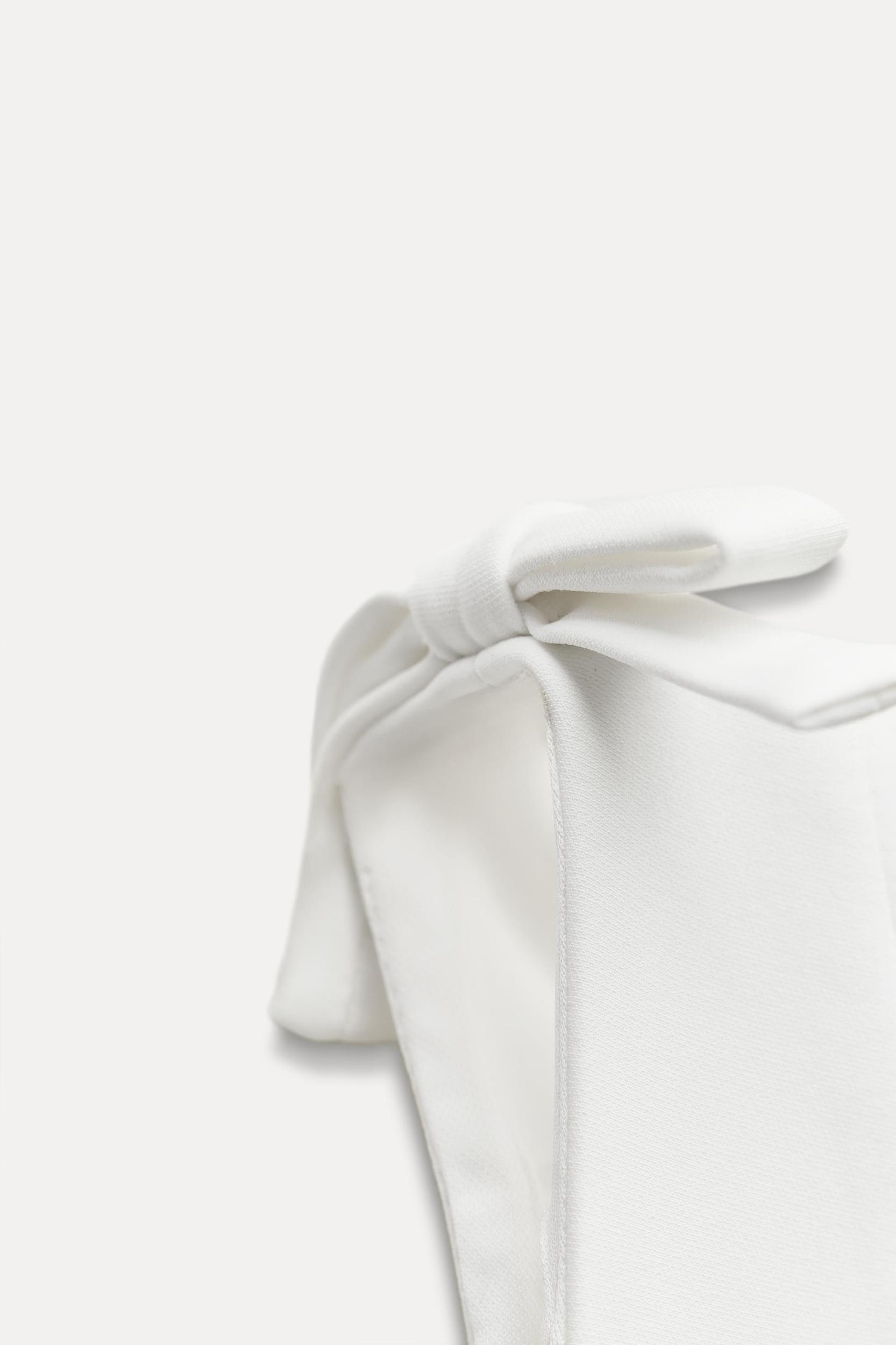 PEPLUM BOWS TOP Product Image