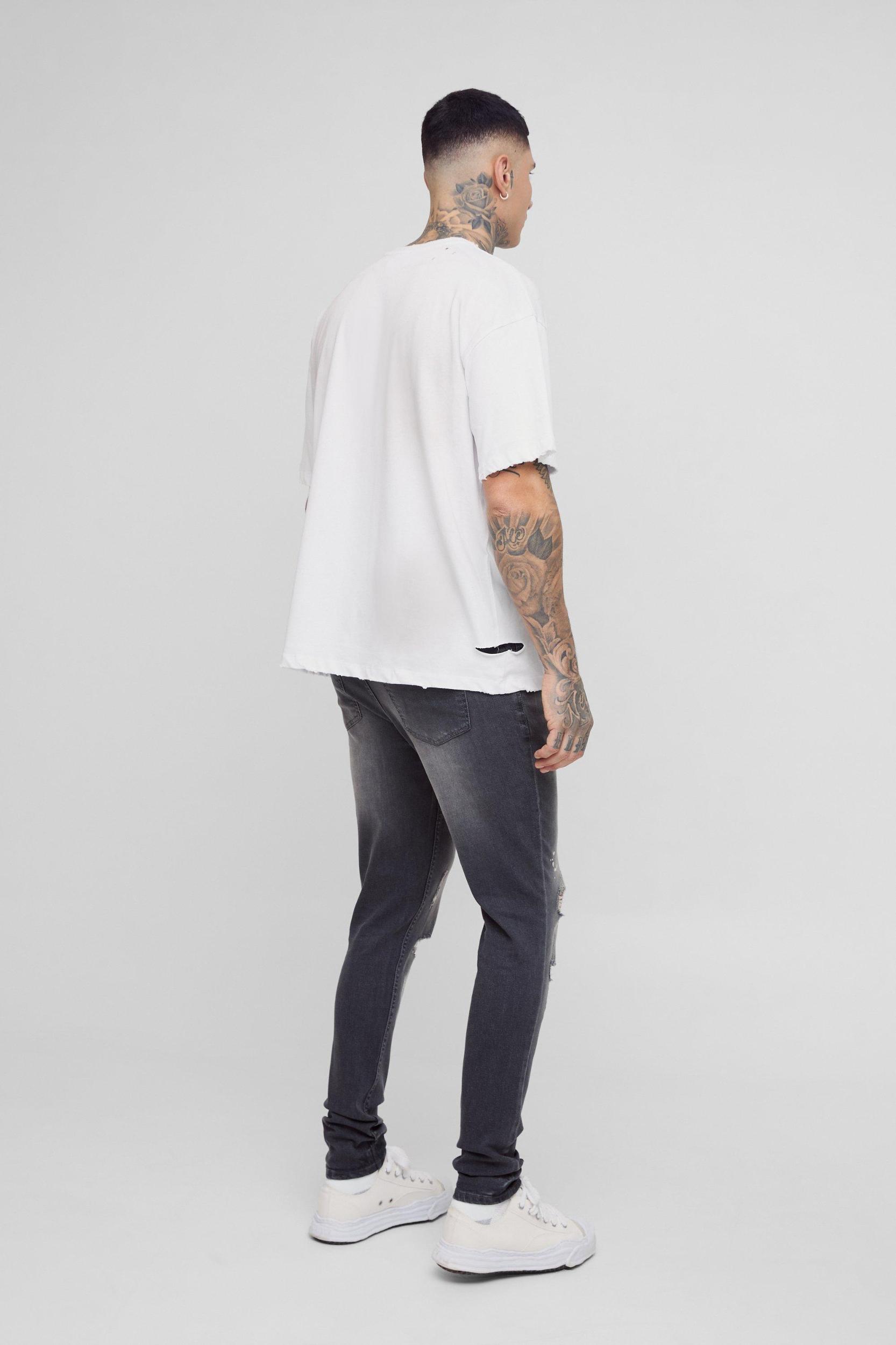 Tall Skinny All Over Ripped Bleached Paint Splatter Jeans | boohooMAN USA Product Image