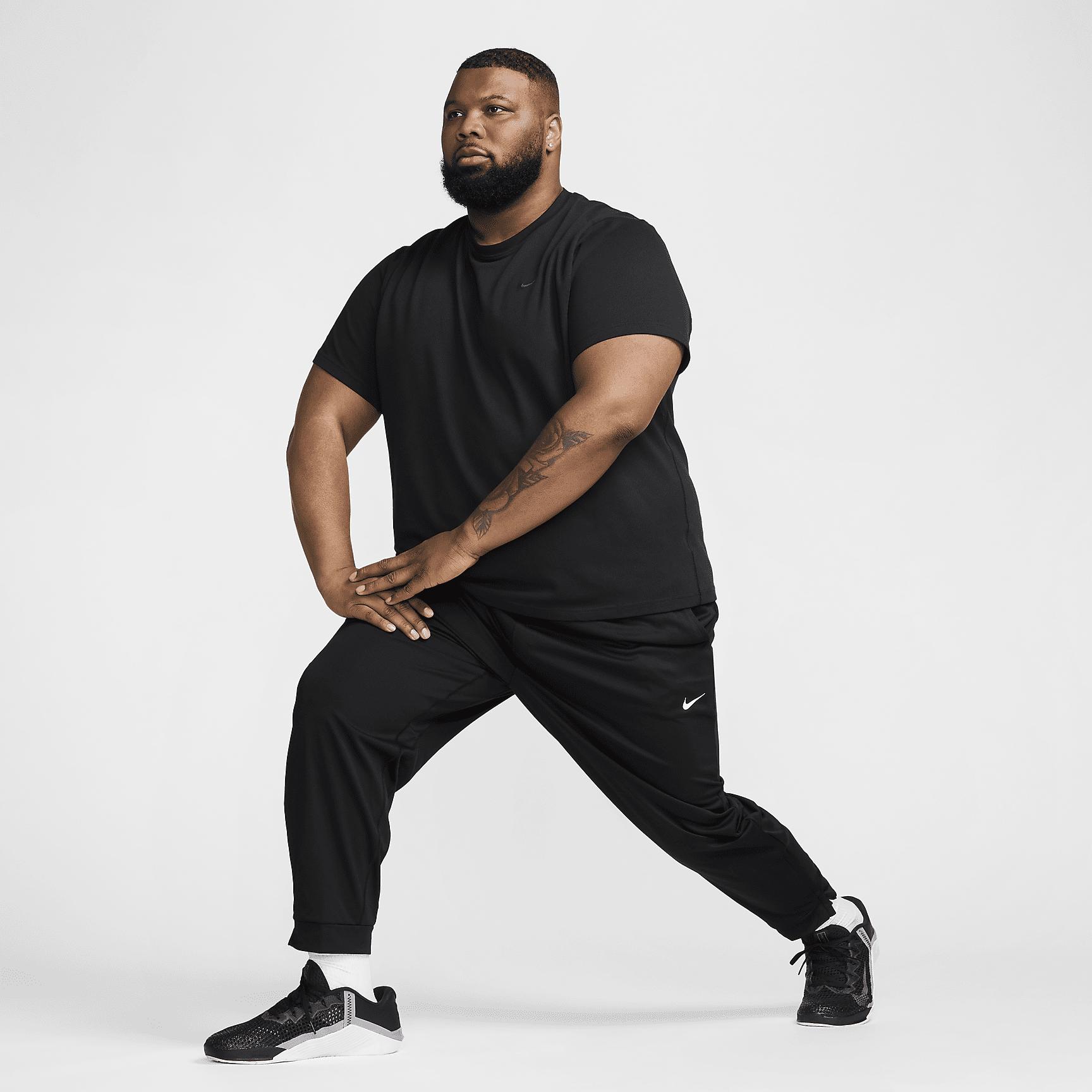 Nike Mens Totality Dri-FIT Tapered Versatile Pants | FB7509-010 Product Image