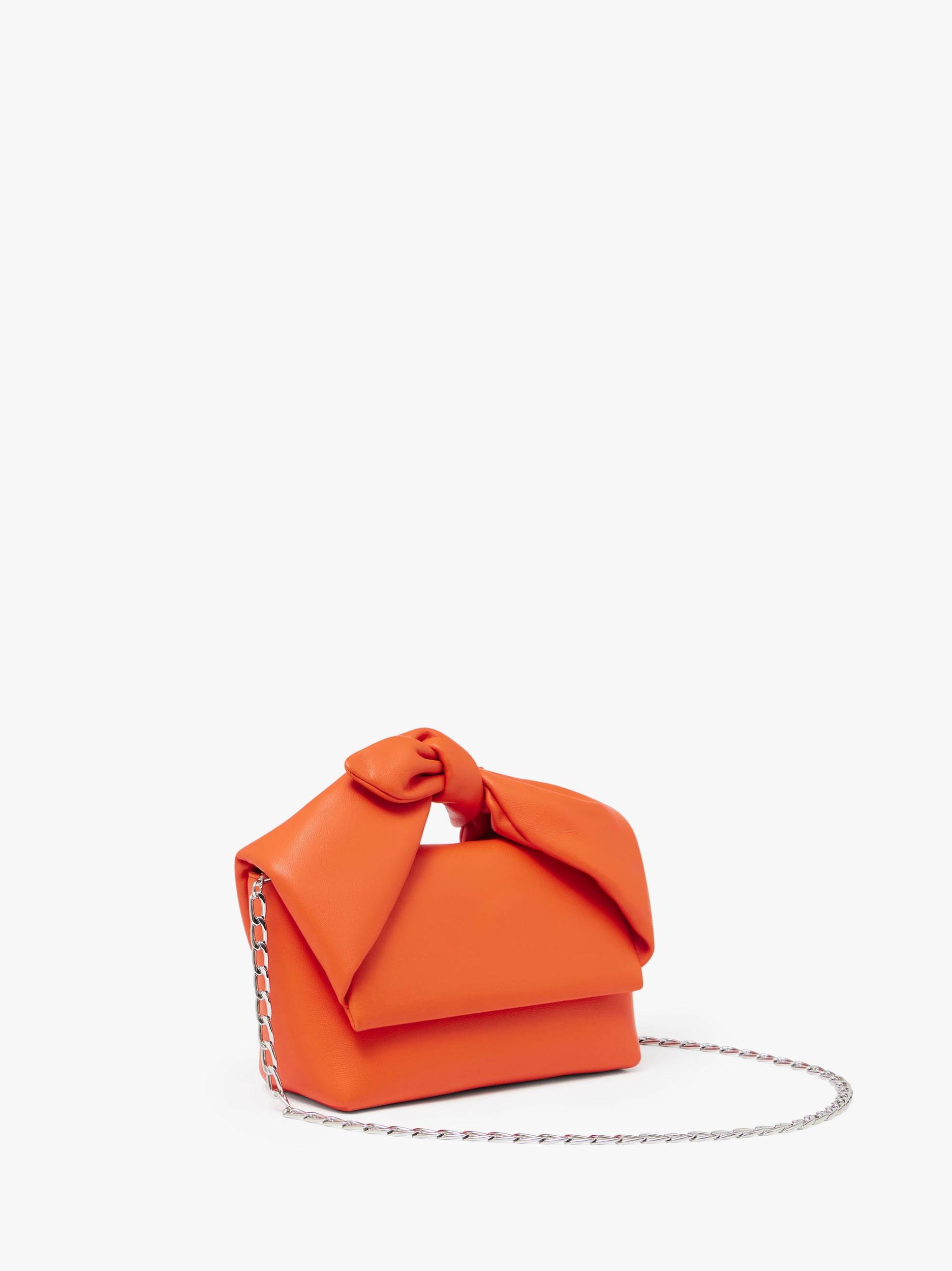 MEDIUM BOW TWISTER - LEATHER TOP HANDLE BAG Product Image