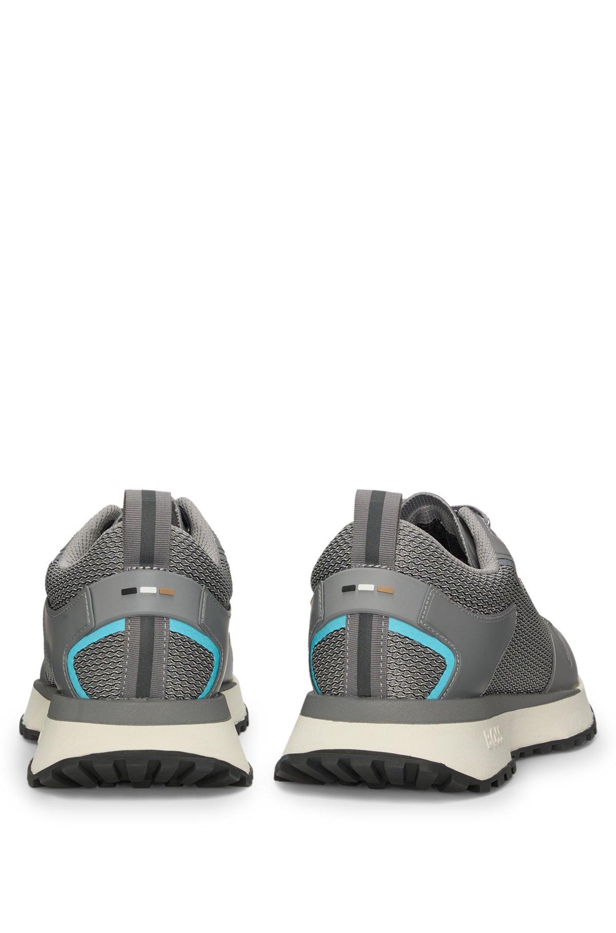 Mixed-material trainers with mesh details and branding Product Image