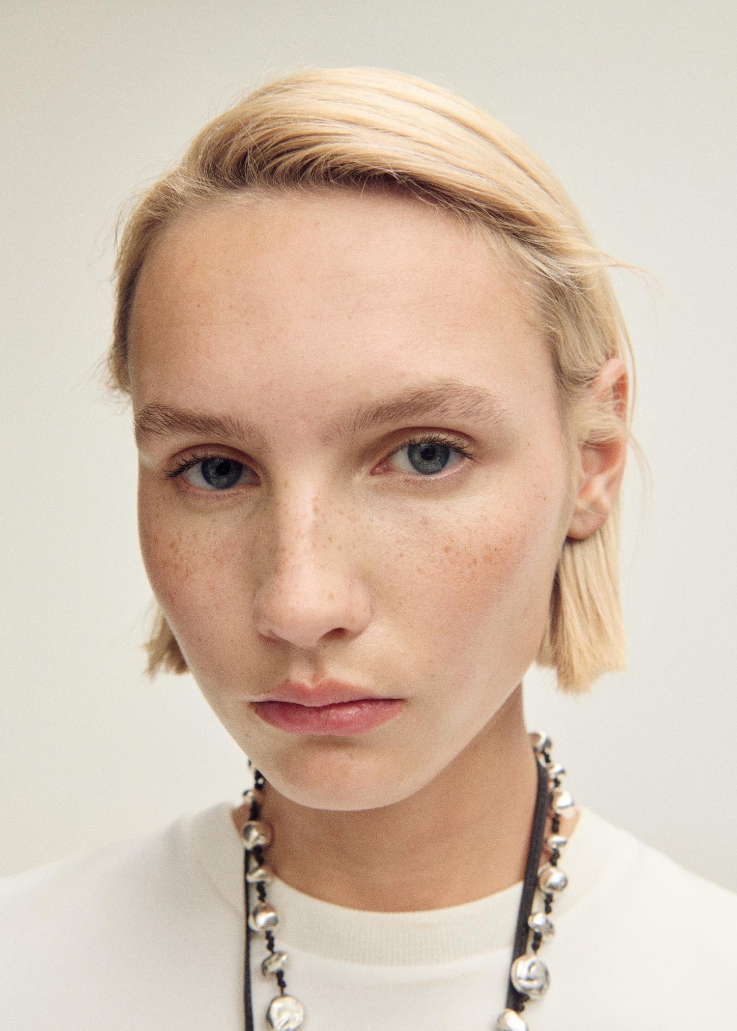 Short-sleeved peplum t-shirt - Women | MANGO USA Product Image