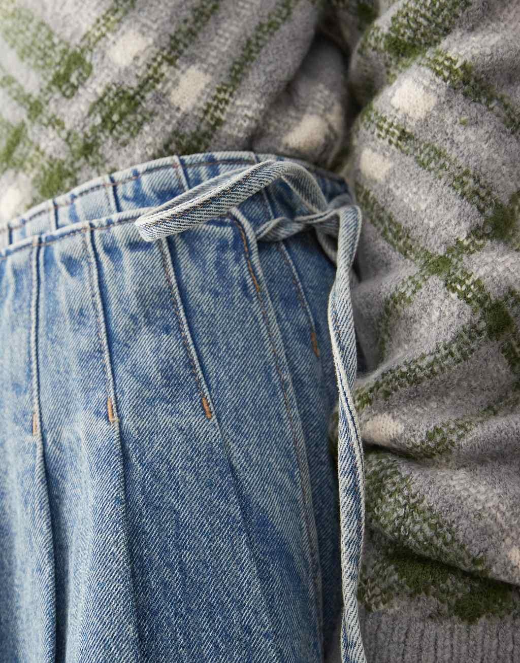 Monki pleated denim mini wrap skirt in mid blue wash Product Image