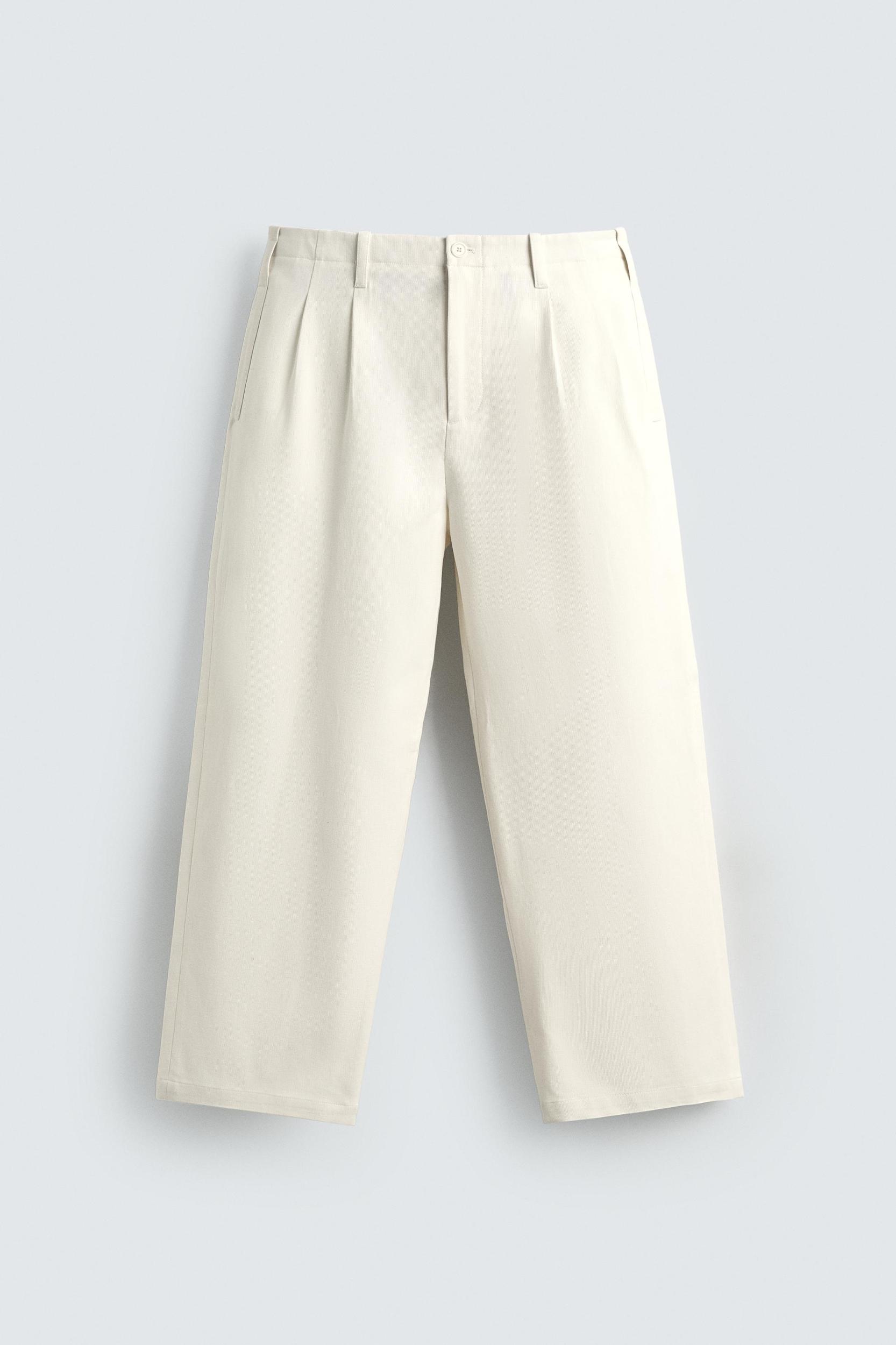 PLEATED WIDE FIT CHINO PANTS Product Image