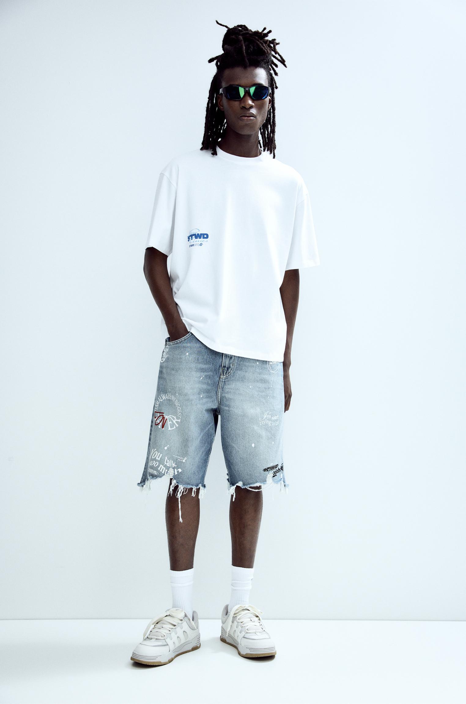 Ripped denim Bermuda shorts Product Image