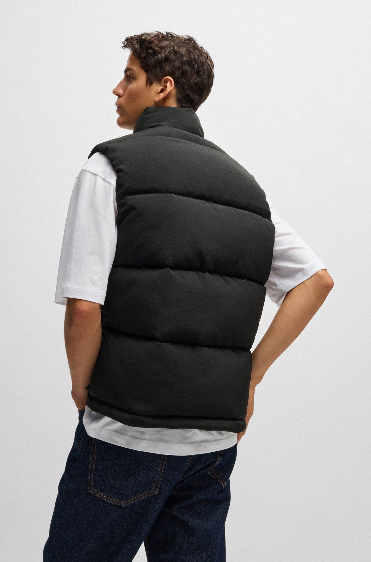 Water-repellent gilet with blue logo label Product Image