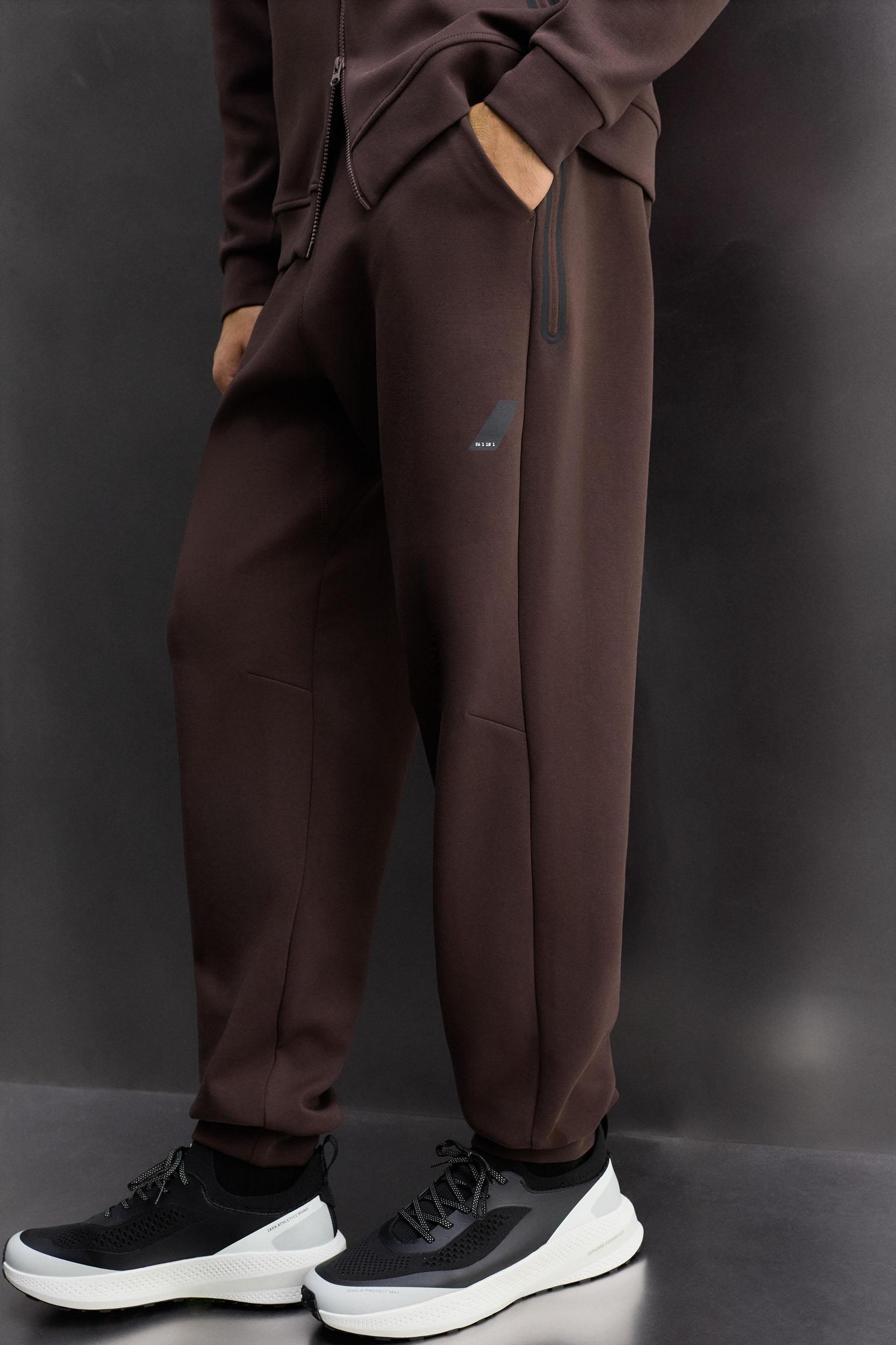 TECHNICAL ZIPPER PANTS Product Image