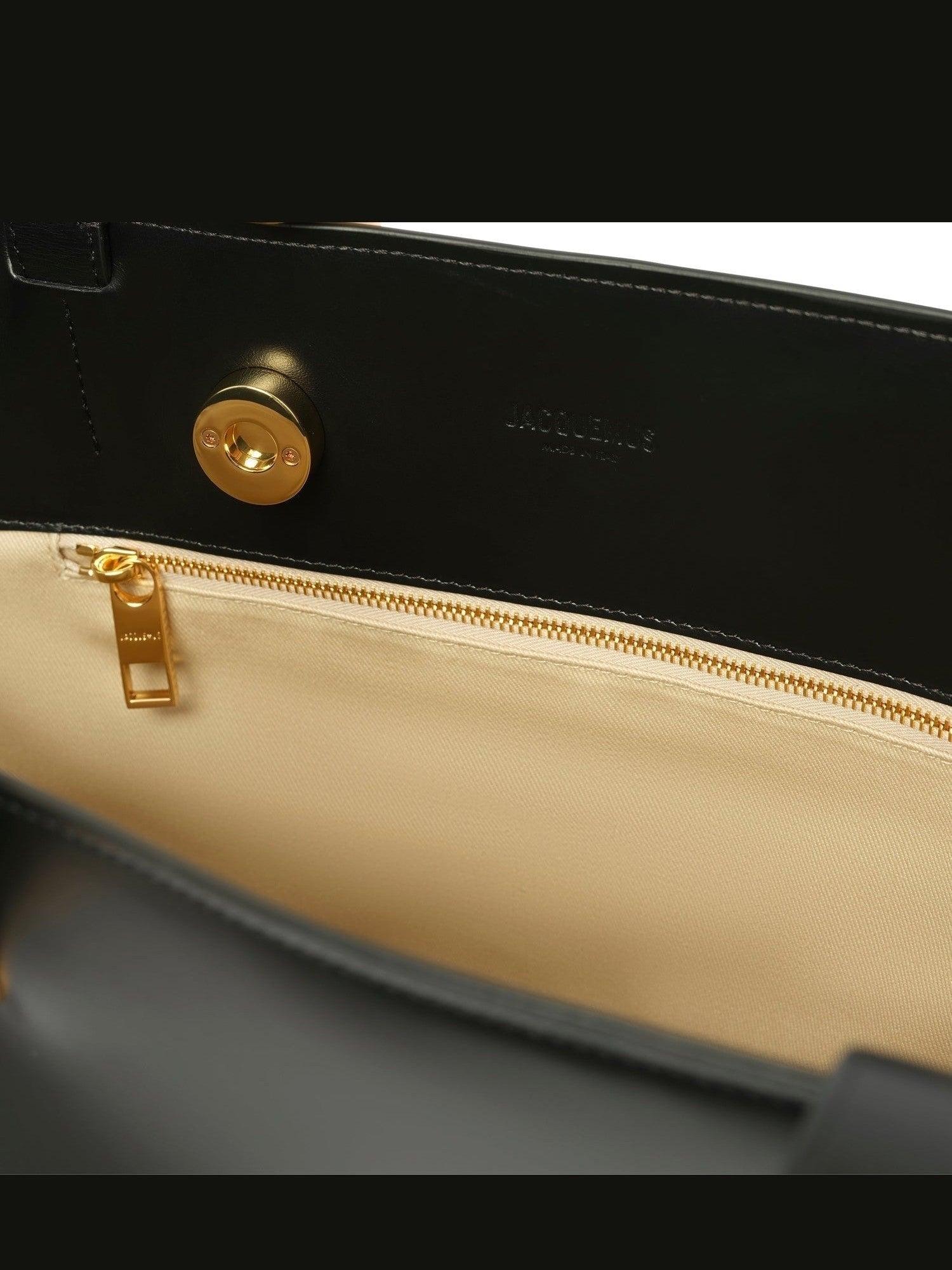 JACQUEMUS The Medium Bambola Asymmetric Leather Bucket Bag In Black 990 Product Image