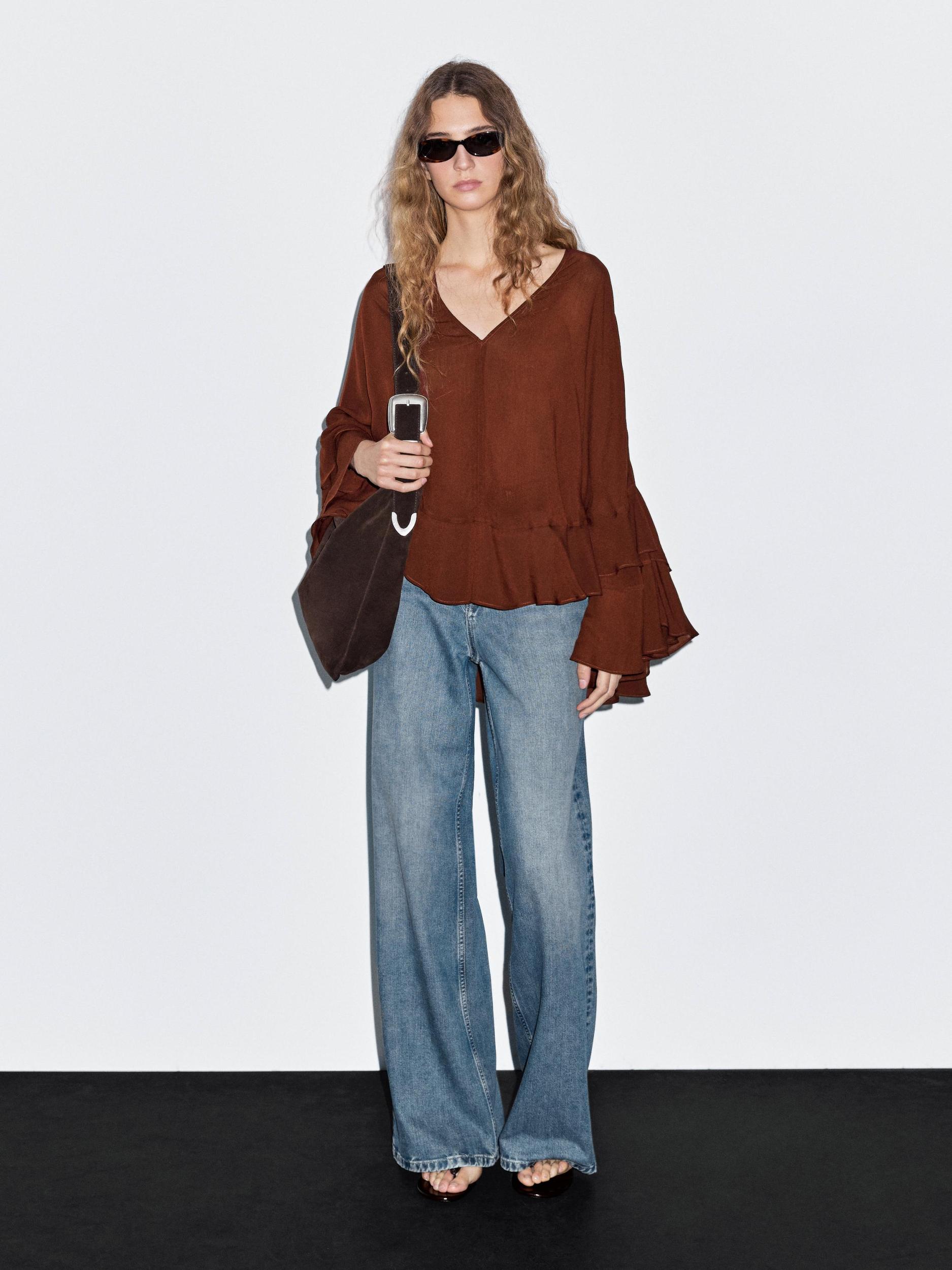 Cape-style blouse with ruffles Product Image