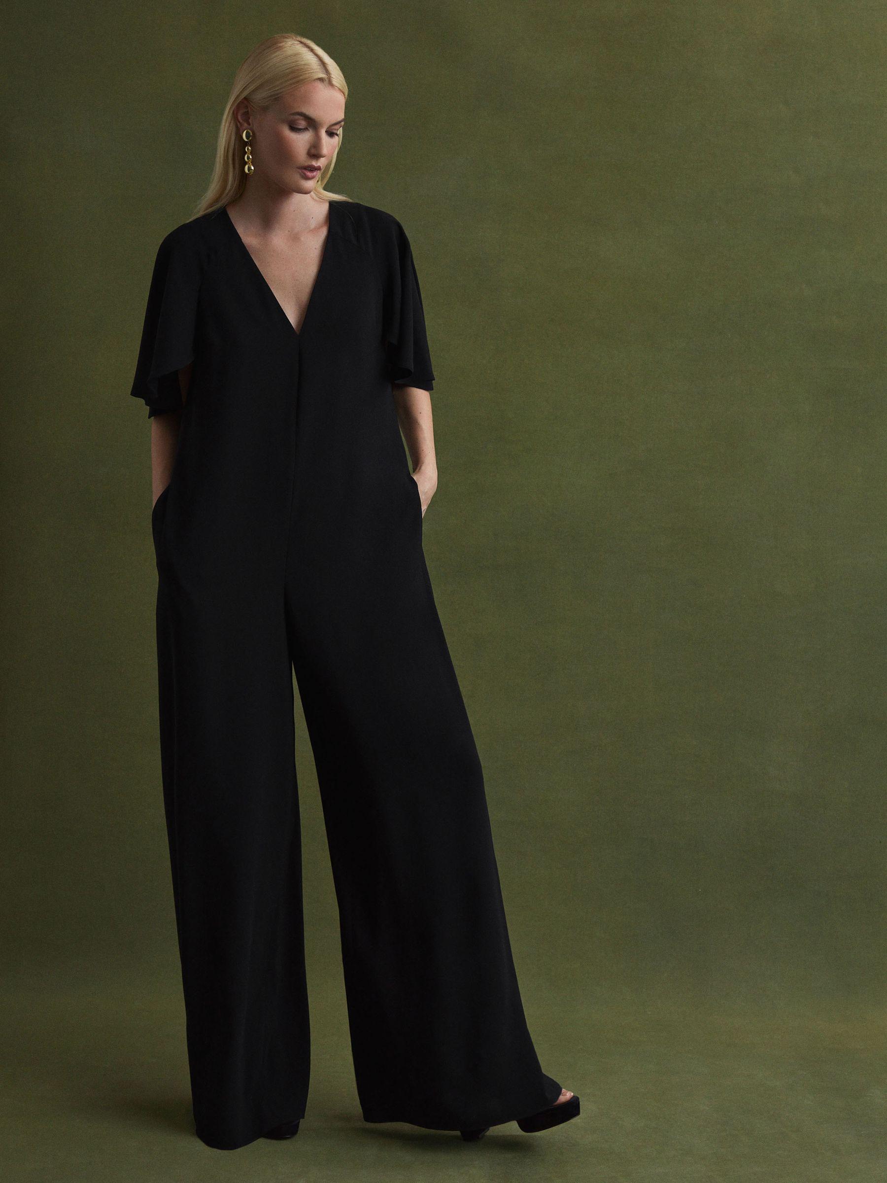 Florere Relaxed Fit Cape Sleeve Jumpsuit in Black Product Image