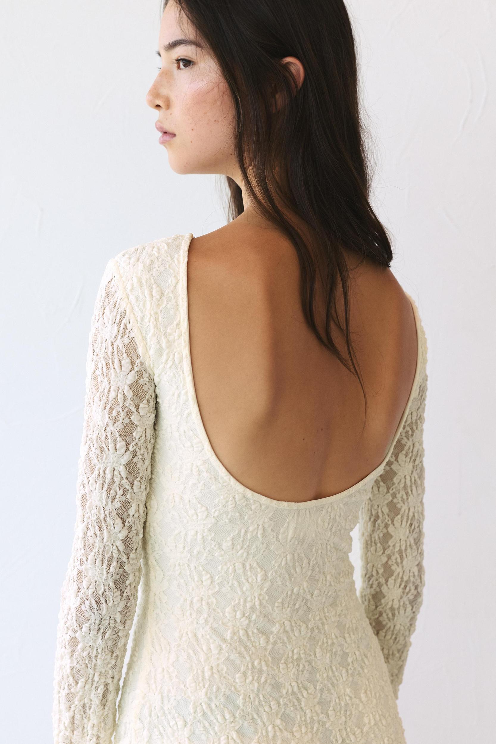 Short lace dress with long sleeves Product Image