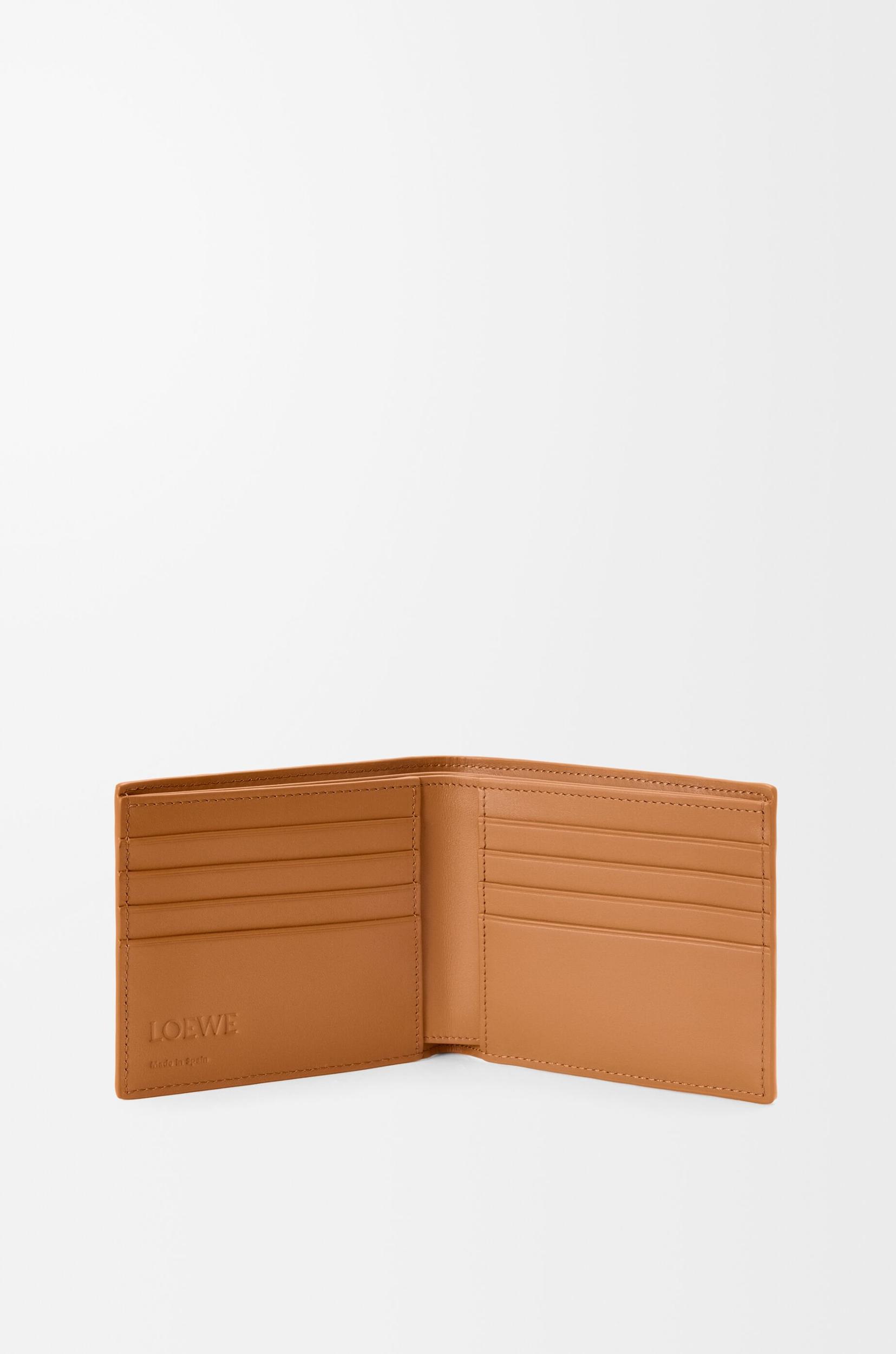 Puzzle bifold wallet in supple grained calfskin Product Image