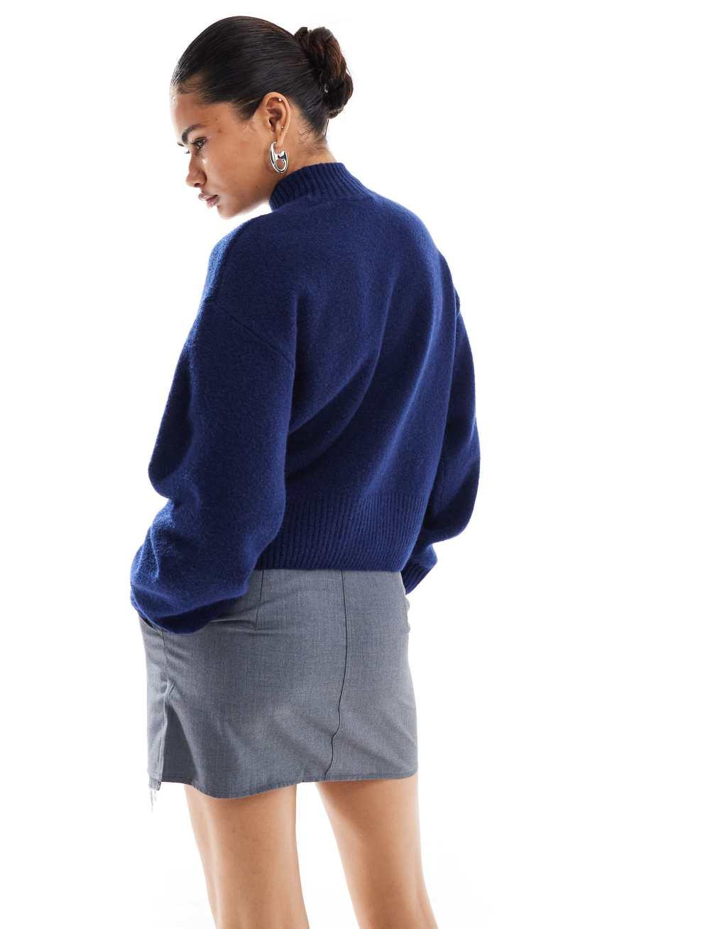 Monki knitted turtleneck sweater in indigo blue Product Image