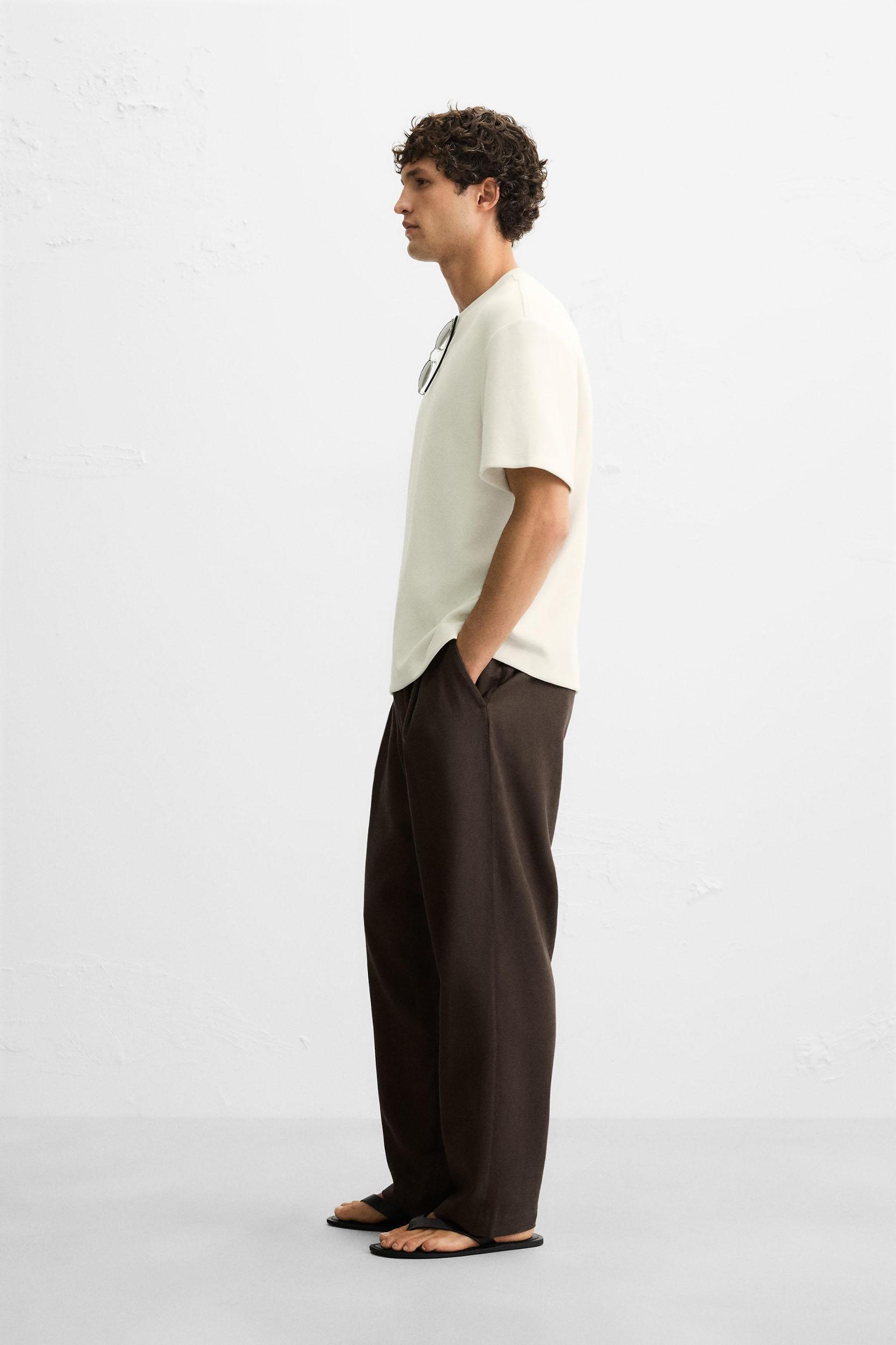 FLOWY PLEATED PANTS Product Image