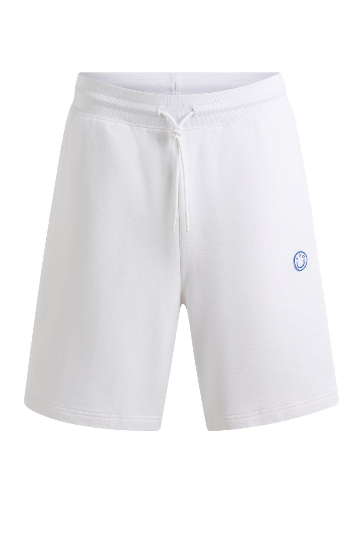 Cotton-terry shorts with Happy HUGO logo Product Image