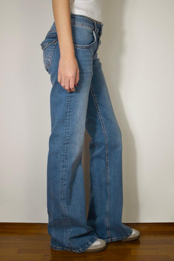 Low waist flared jeans with stars studs Product Image