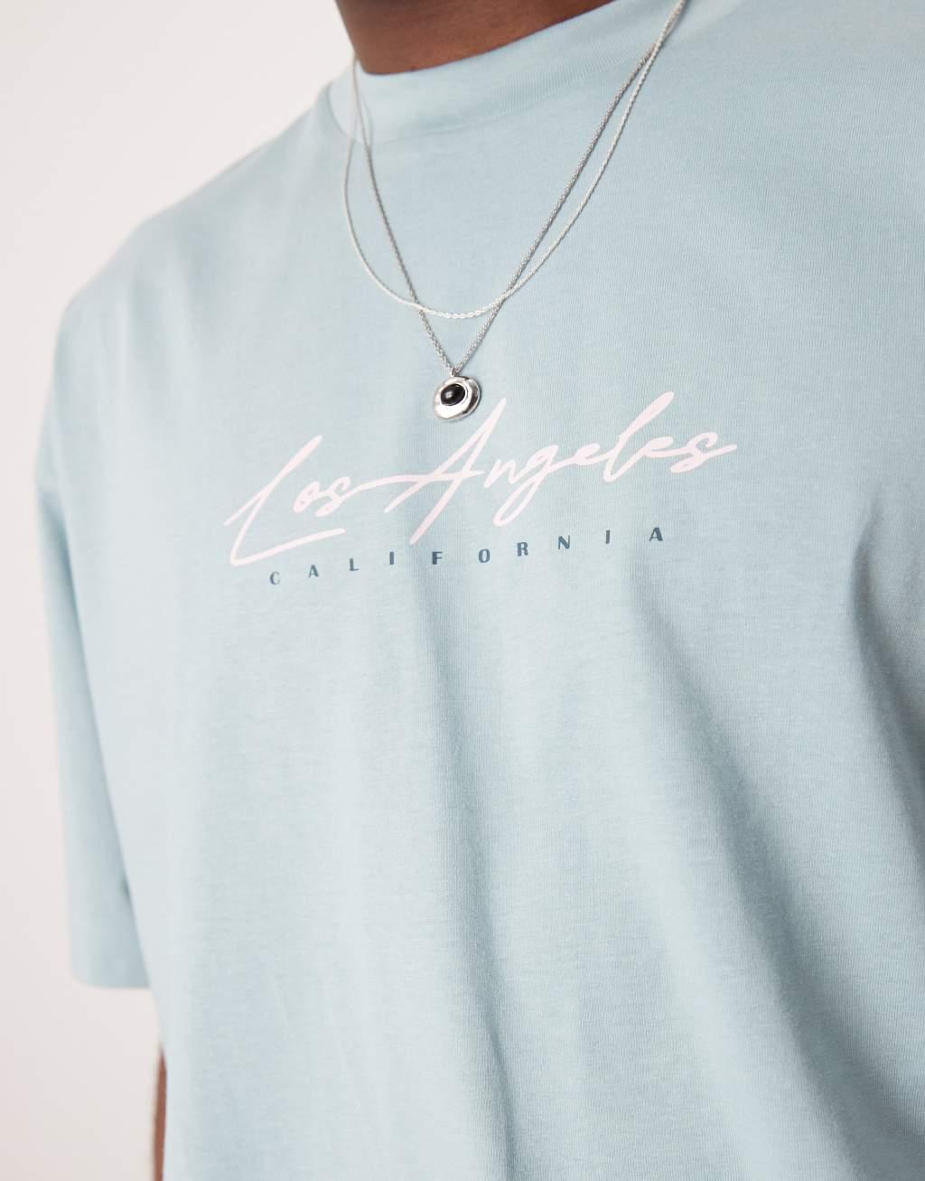 ASOS DESIGN oversized T-shirt with floral graphic in light blue Product Image