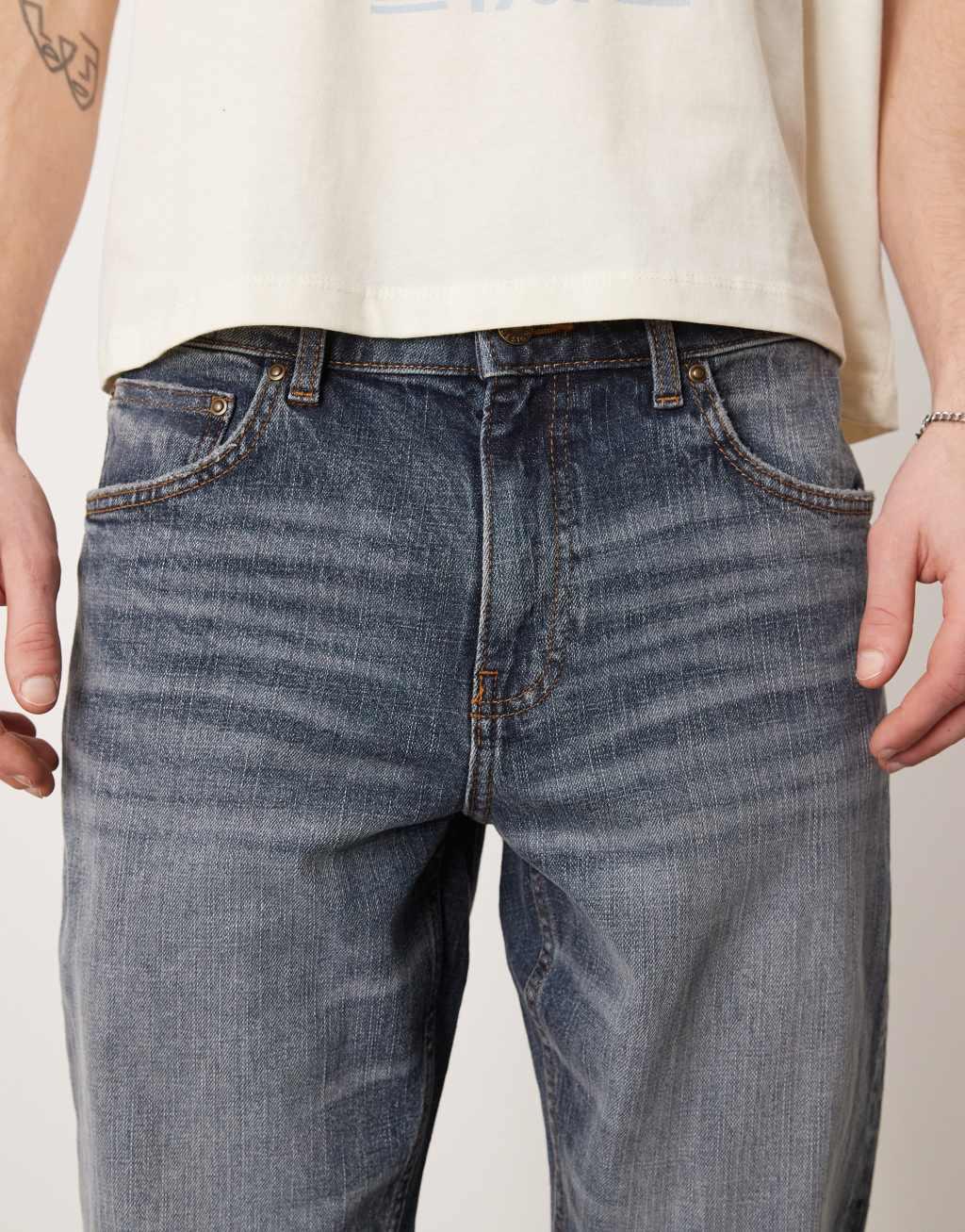 ASOS DESIGN stretch tapered jeans in mid wash blue Product Image