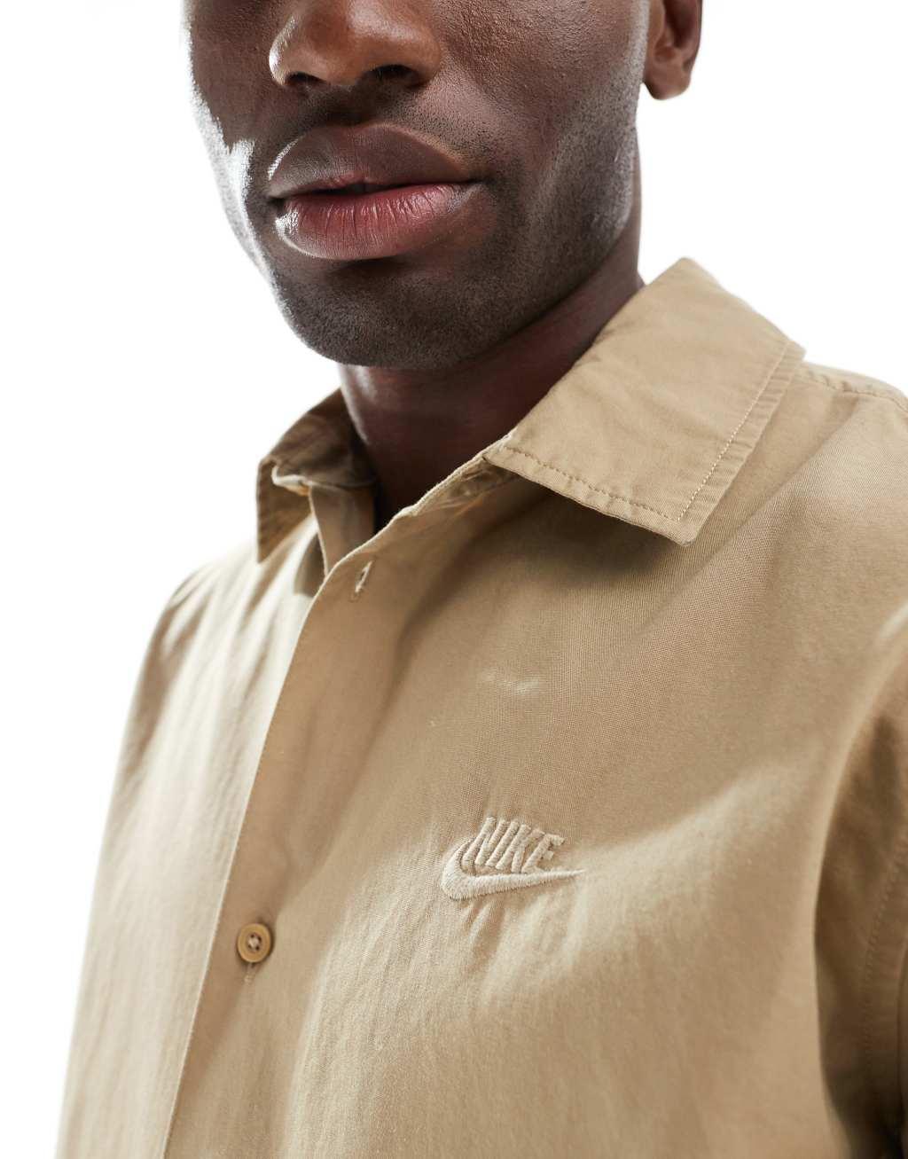 Nike Club short sleeve woven shirt in beige Product Image