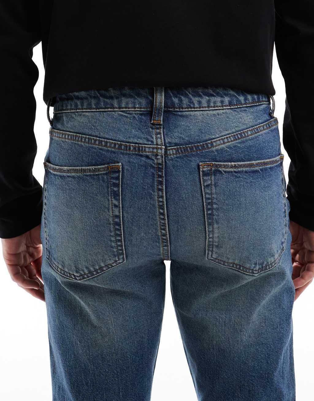 ASOS DESIGN stretch flare jeans in mid wash blue Product Image