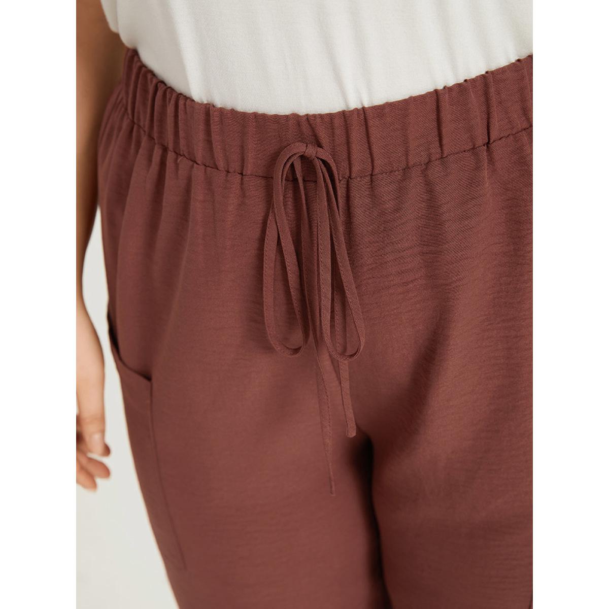 Plus Size Solid Patched Pocket Bowknot Button Detail Pants Women Rust Casual High Rise Dailywear Pants BloomChic 10/M Product Image