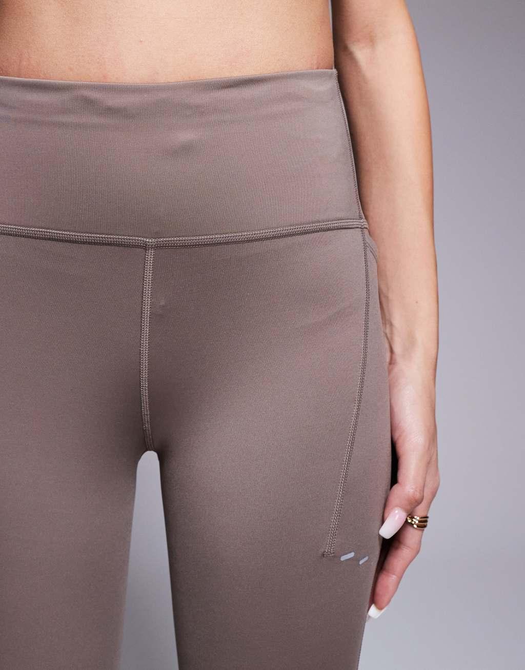 Nike Running Swift 7/8 leggings in brown Product Image
