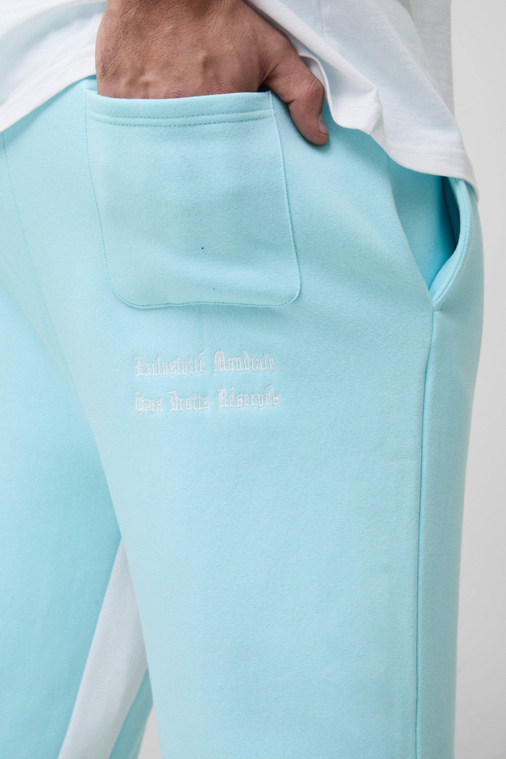 Plus Official Embroidery Relaxed Flare Sweatpants | boohooMAN USA Product Image