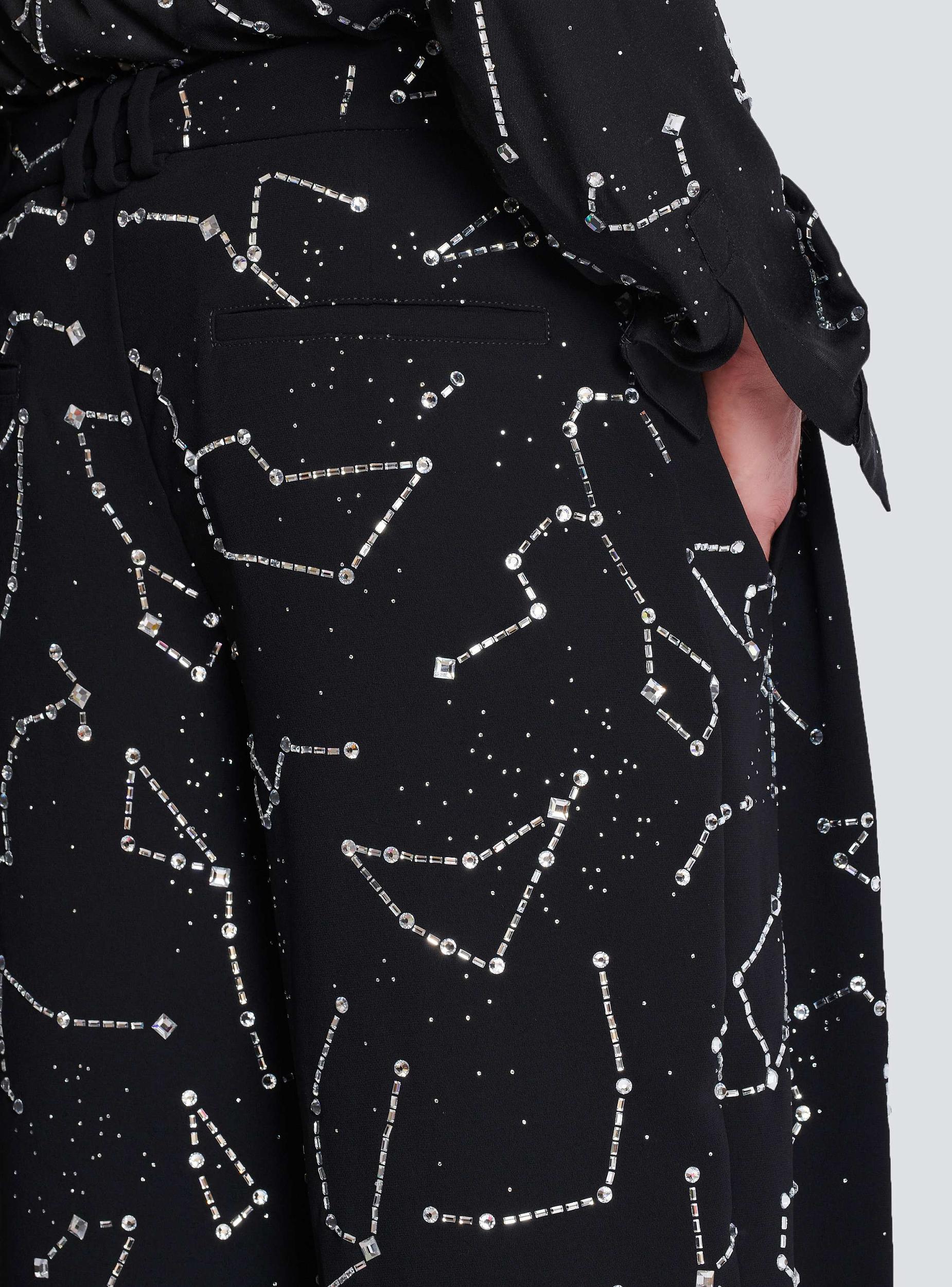 Crepe trousers with rhinestone Constellation motif Product Image