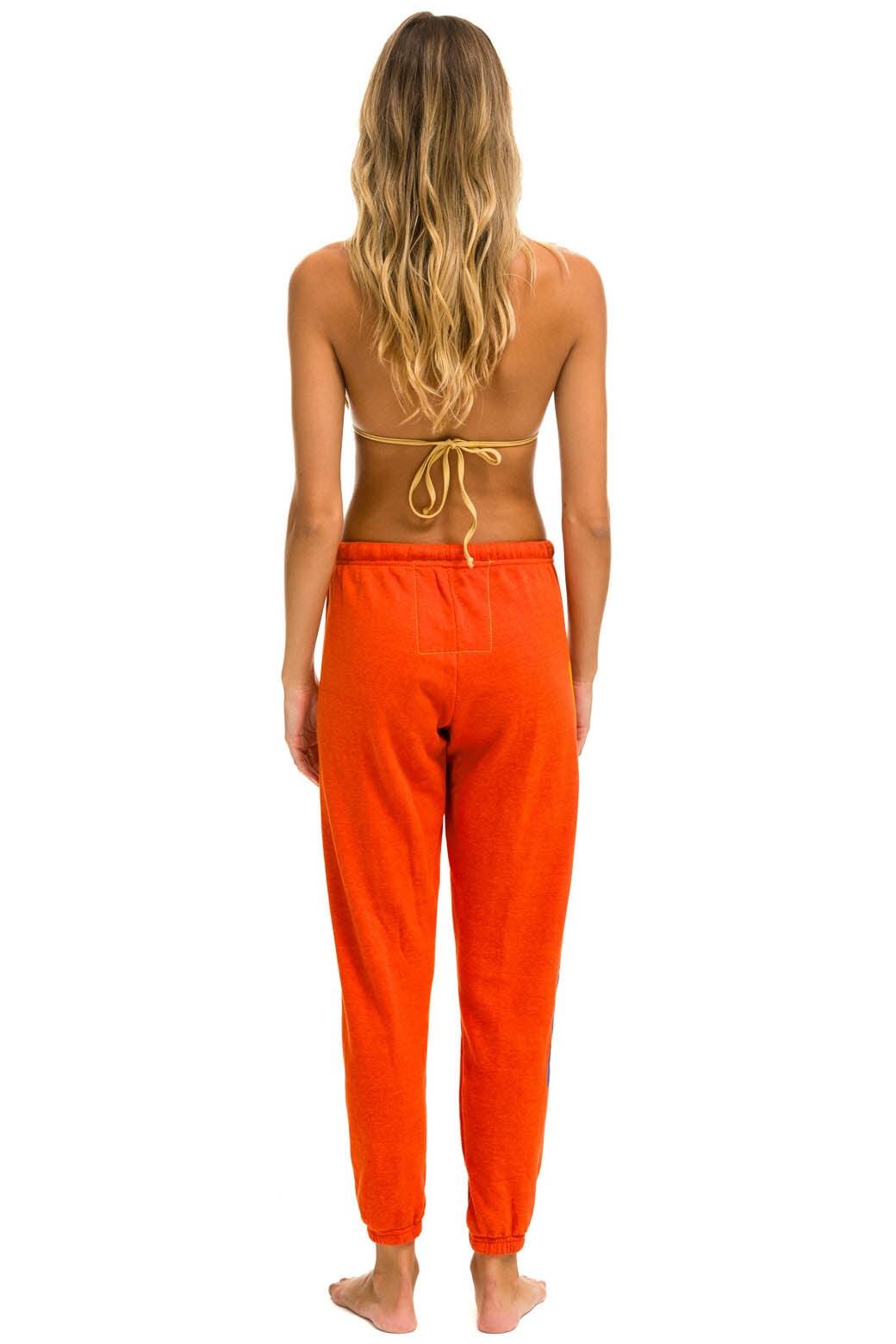 RIDE LOGO SWEATPANTS - ORANGE Female Product Image
