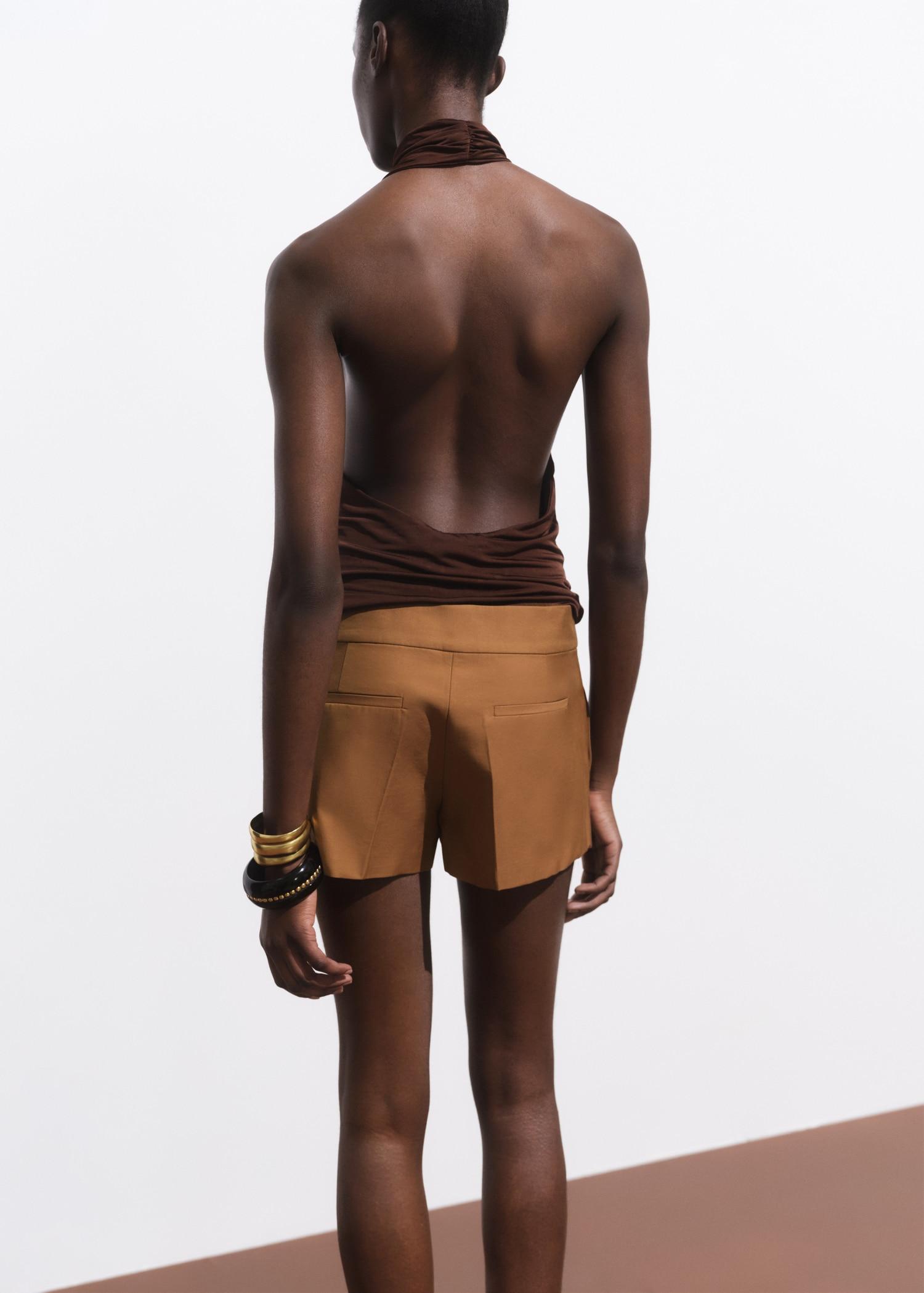 Mini-skirt with pleats - Women | MANGO USA Product Image