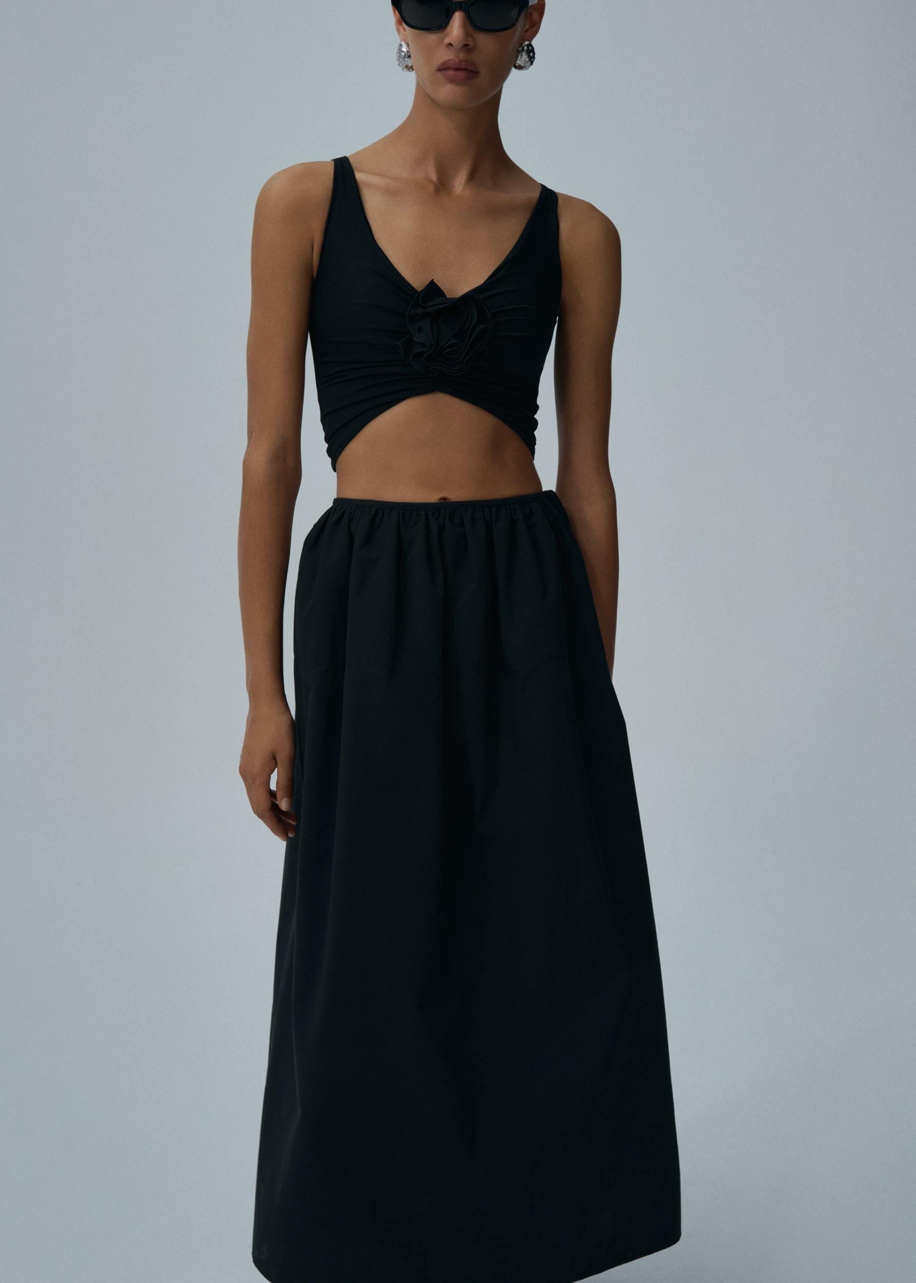 Ruched flower top in black Product Image