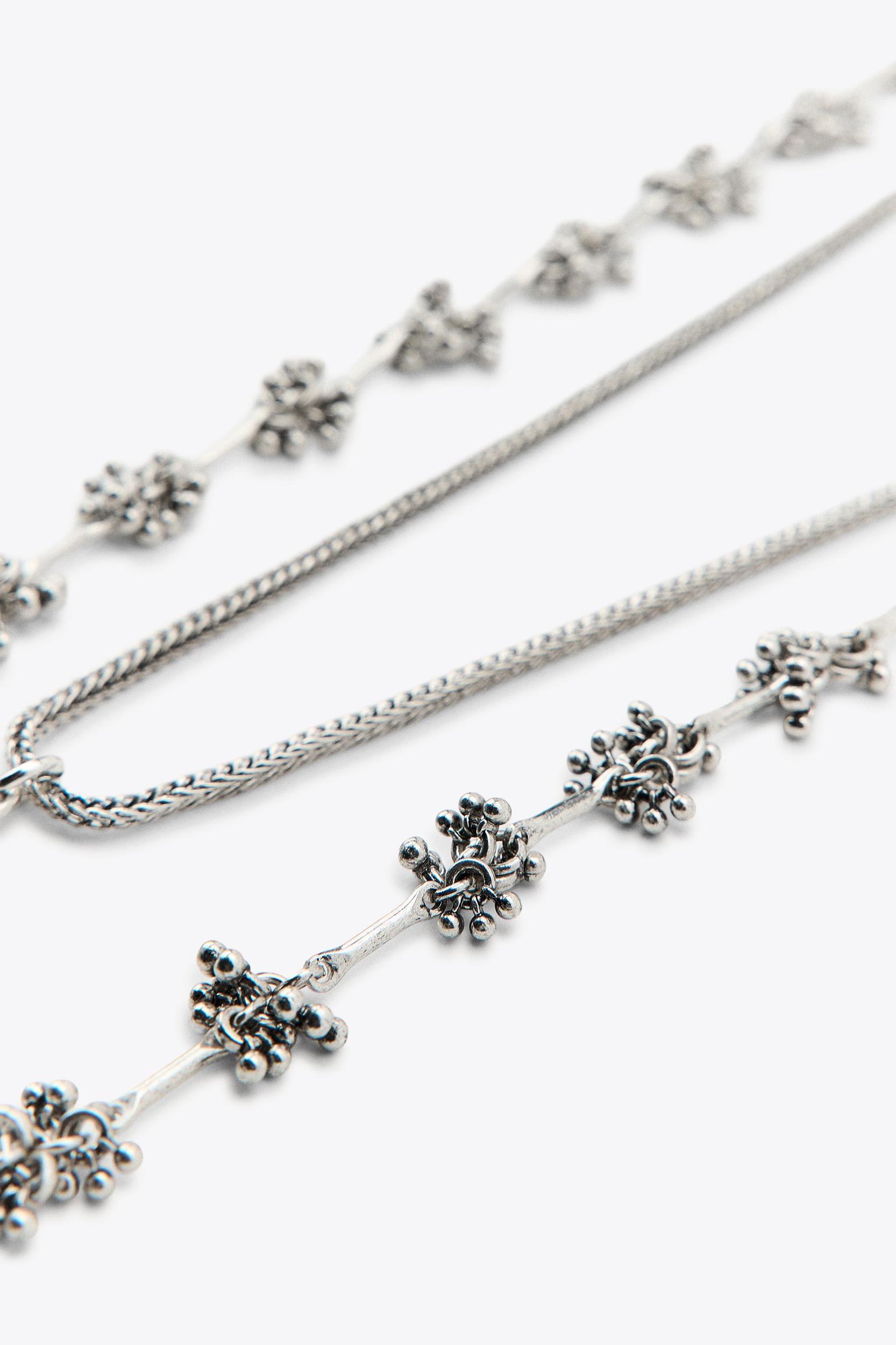 2-PACK NECKLACES WITH PIECES AND BOTTLE Product Image