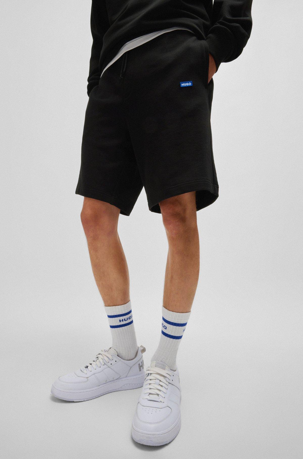 Cotton-terry shorts with blue logo patch Product Image