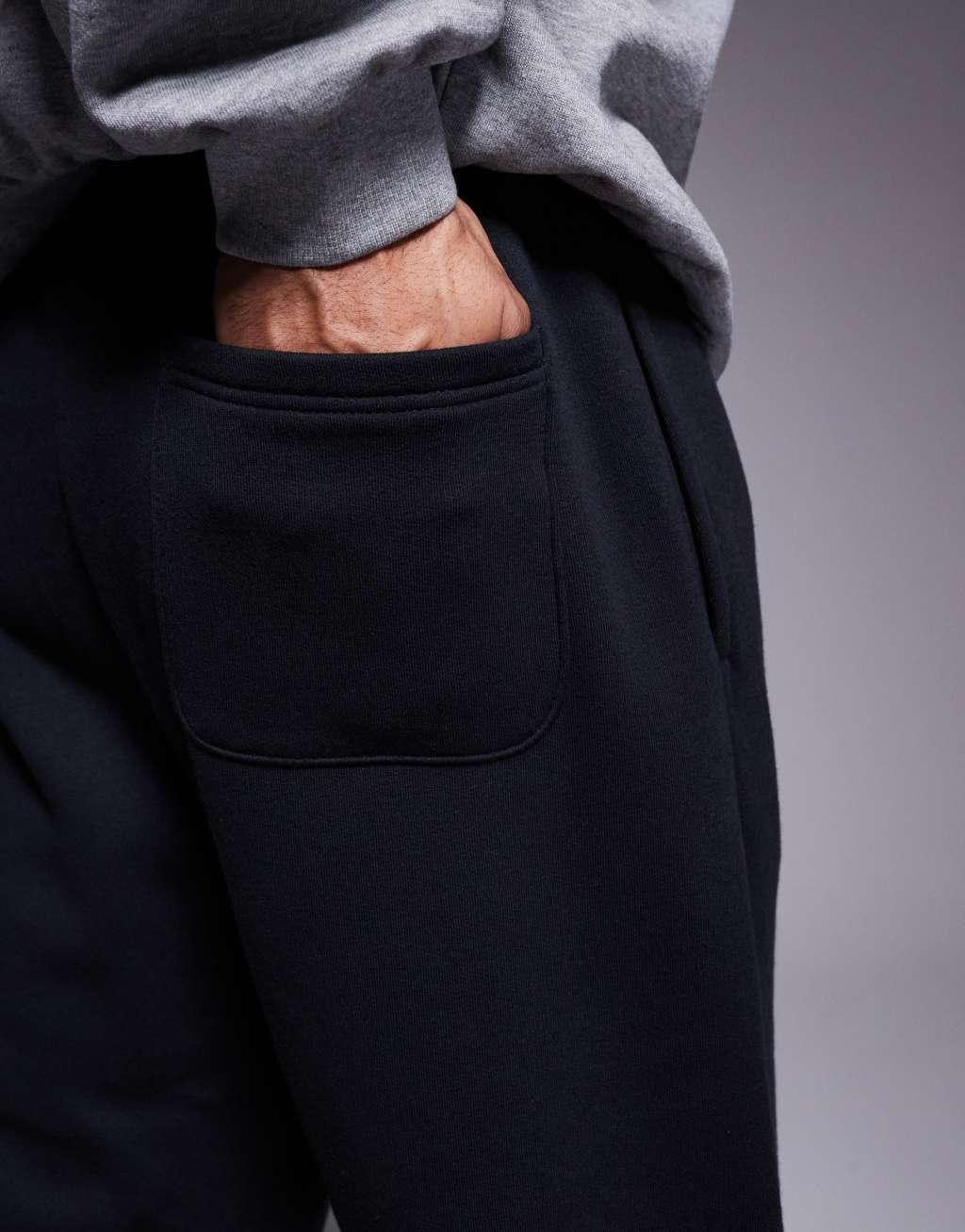 New Balance Sport Essentials Fleece track pants in black Product Image