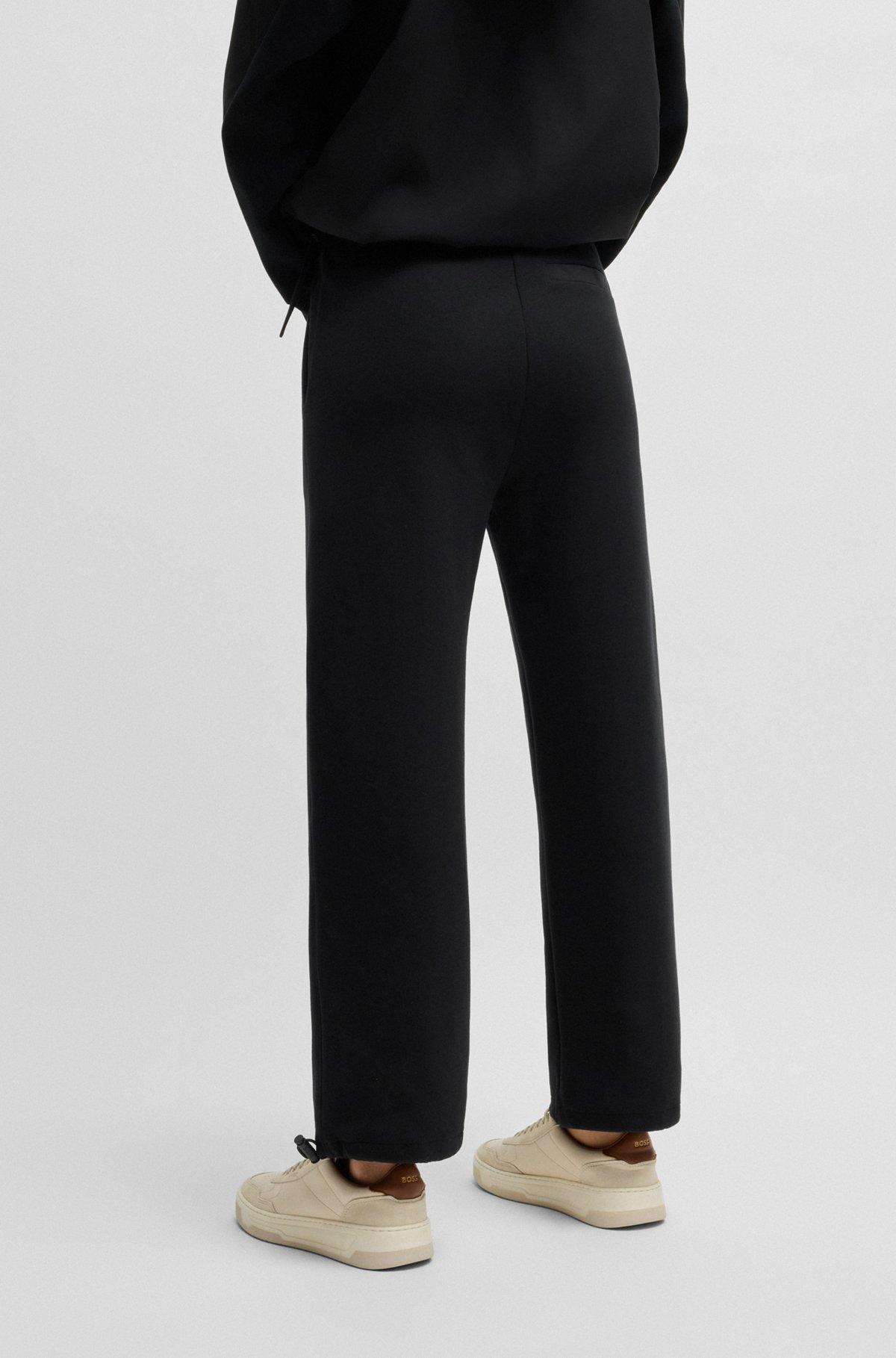 BOSS - Tracksuit bottoms with adjustable hems - Black Product Image