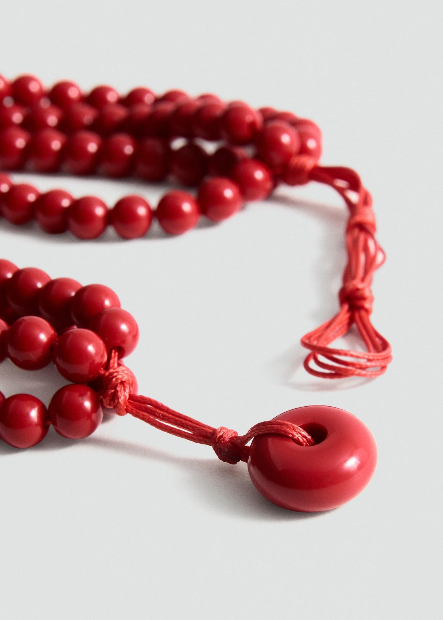 Ball necklace with flower detail - Women | MANGO USA Product Image