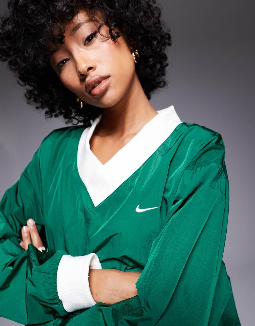 Nike Essential woven long sleeve v neck sweater in green Product Image