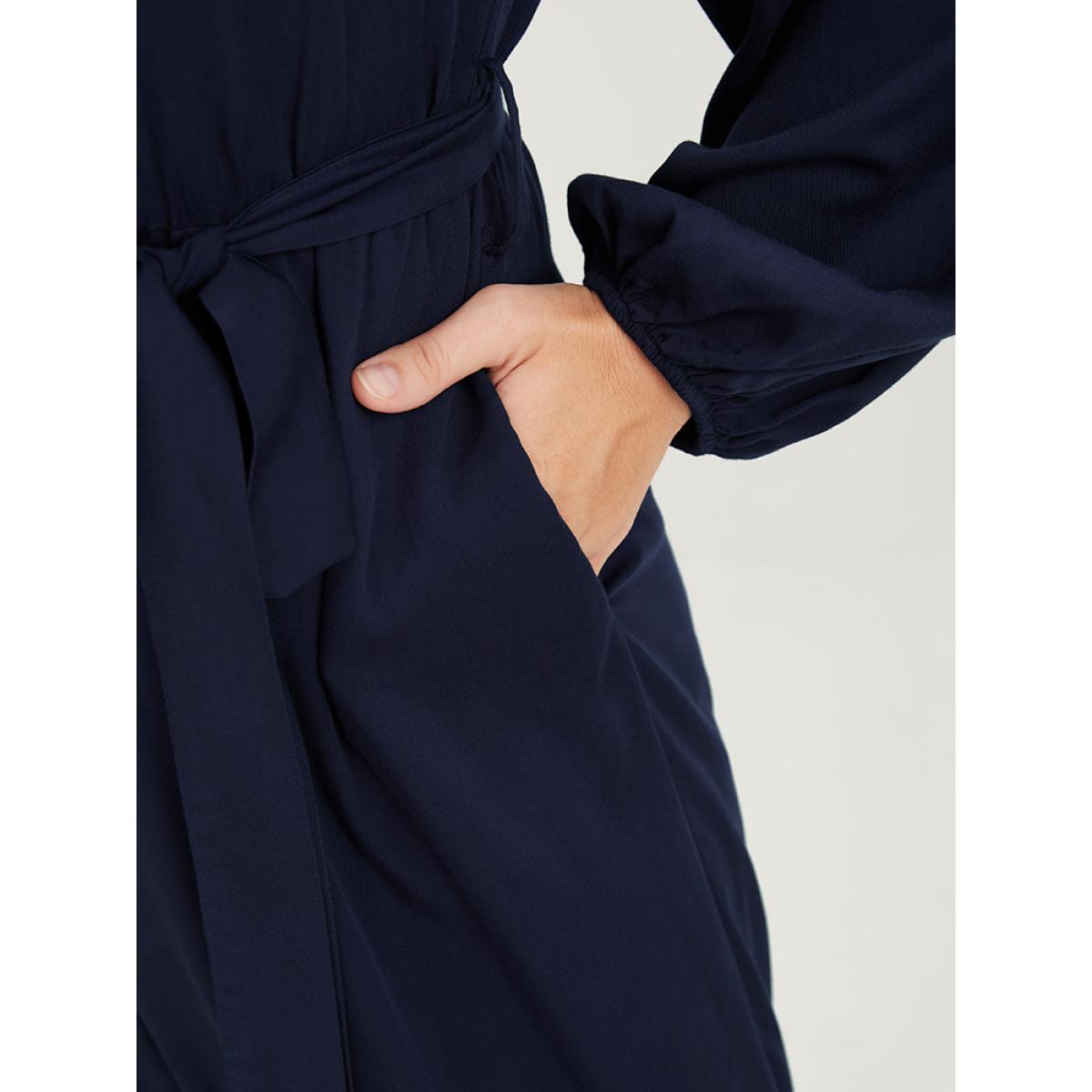 Plus Size DarkBlue Solid V Neck Lantern Sleeve Embroidered Pocket Ties Jumpsuit Women Elegant Long Sleeve V-neck Dailywear Loose Jumpsuits BloomChic 10/M Product Image
