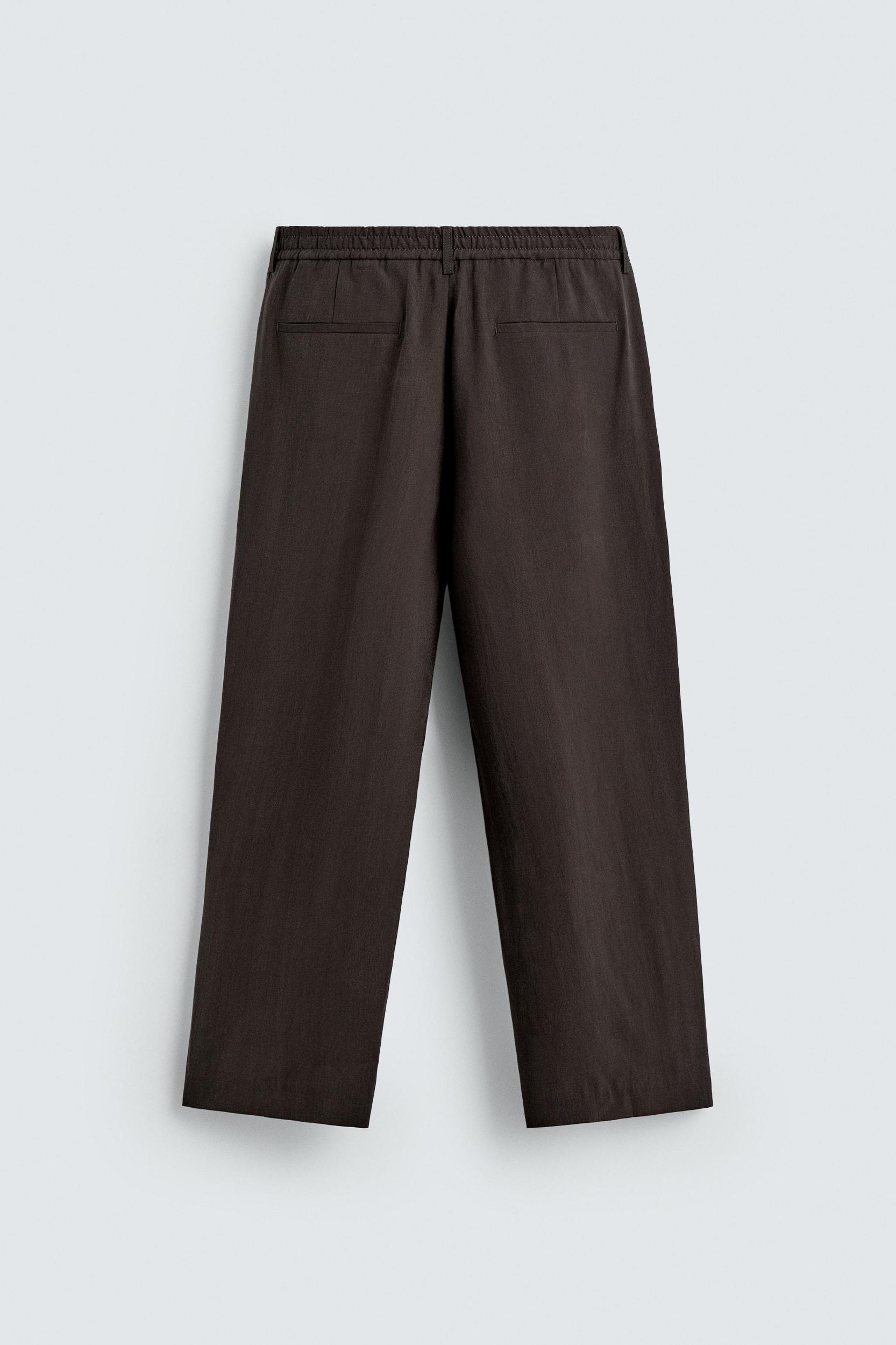 PLEATED FLOWY PANTS Product Image