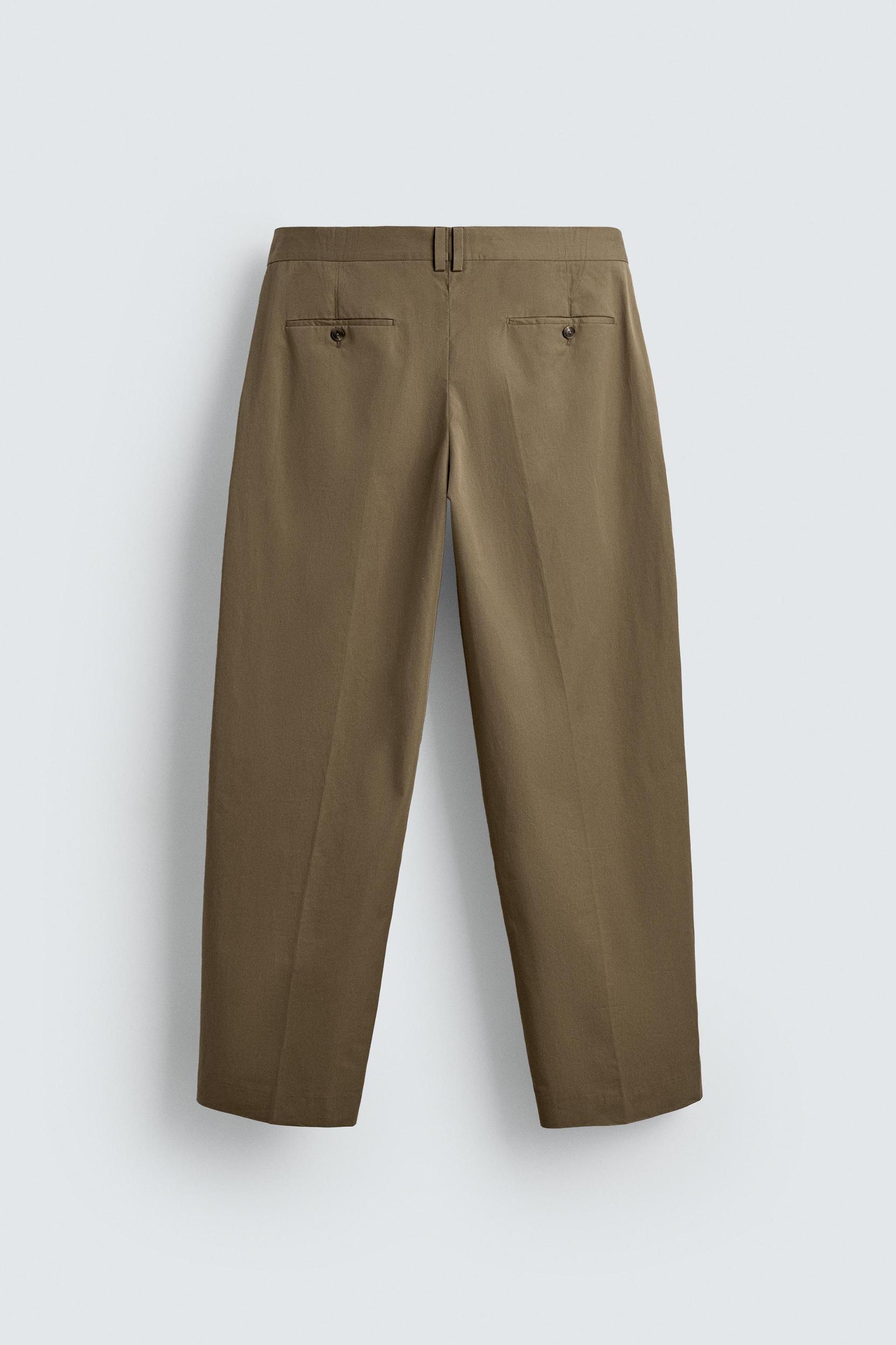 LIMITED EDITION RELAXED FIT PLEATED PANTS Product Image