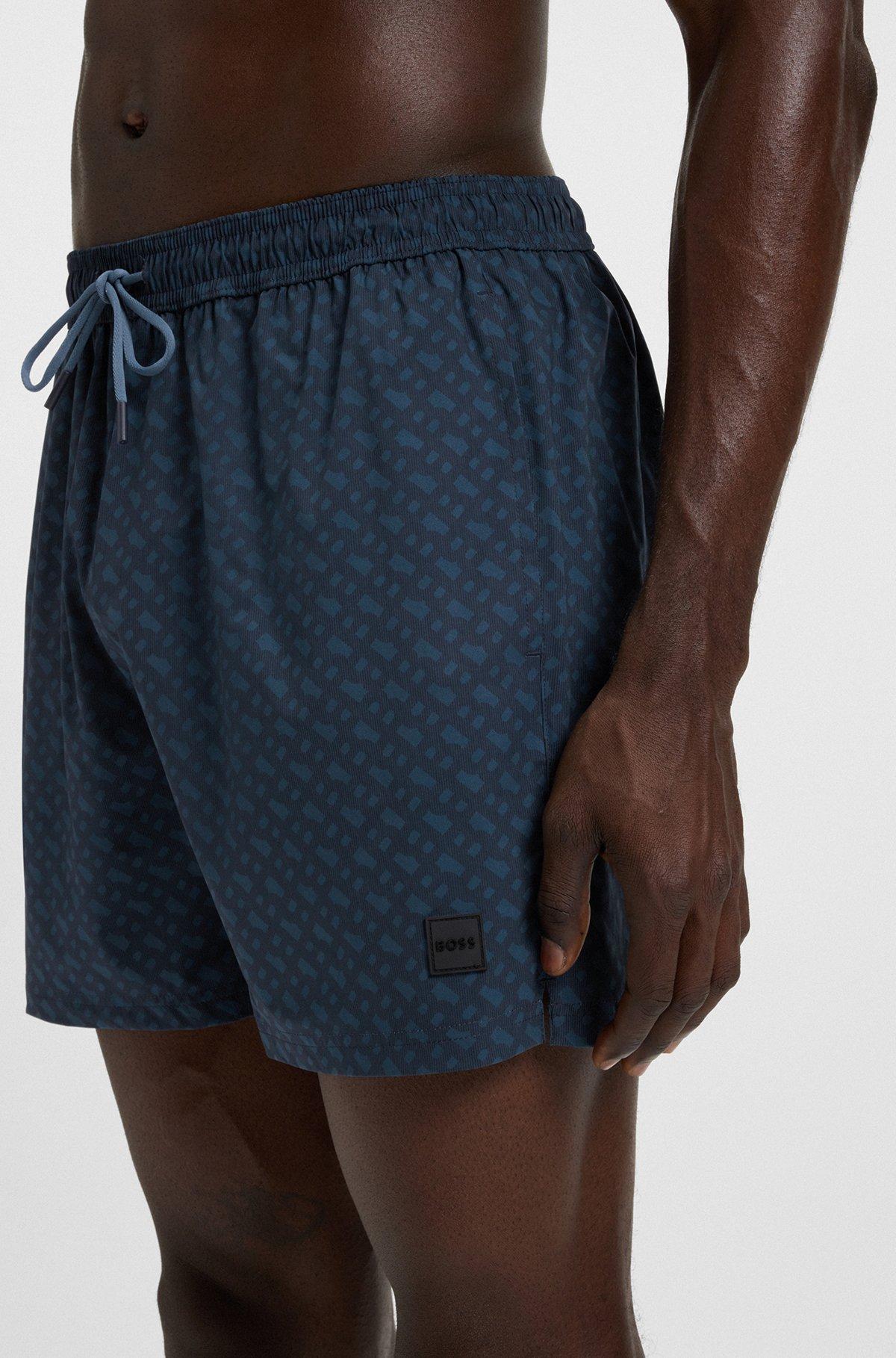 Logo-badge swim shorts with degradé monogram print Product Image