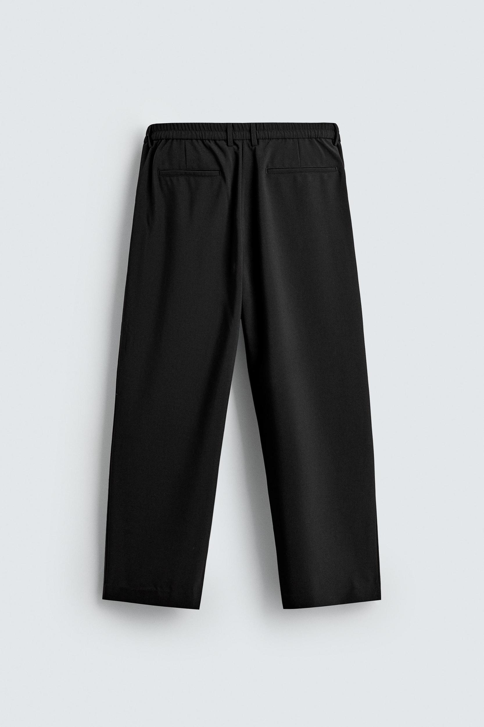 PLEATED WIDE FIT PANTS Product Image