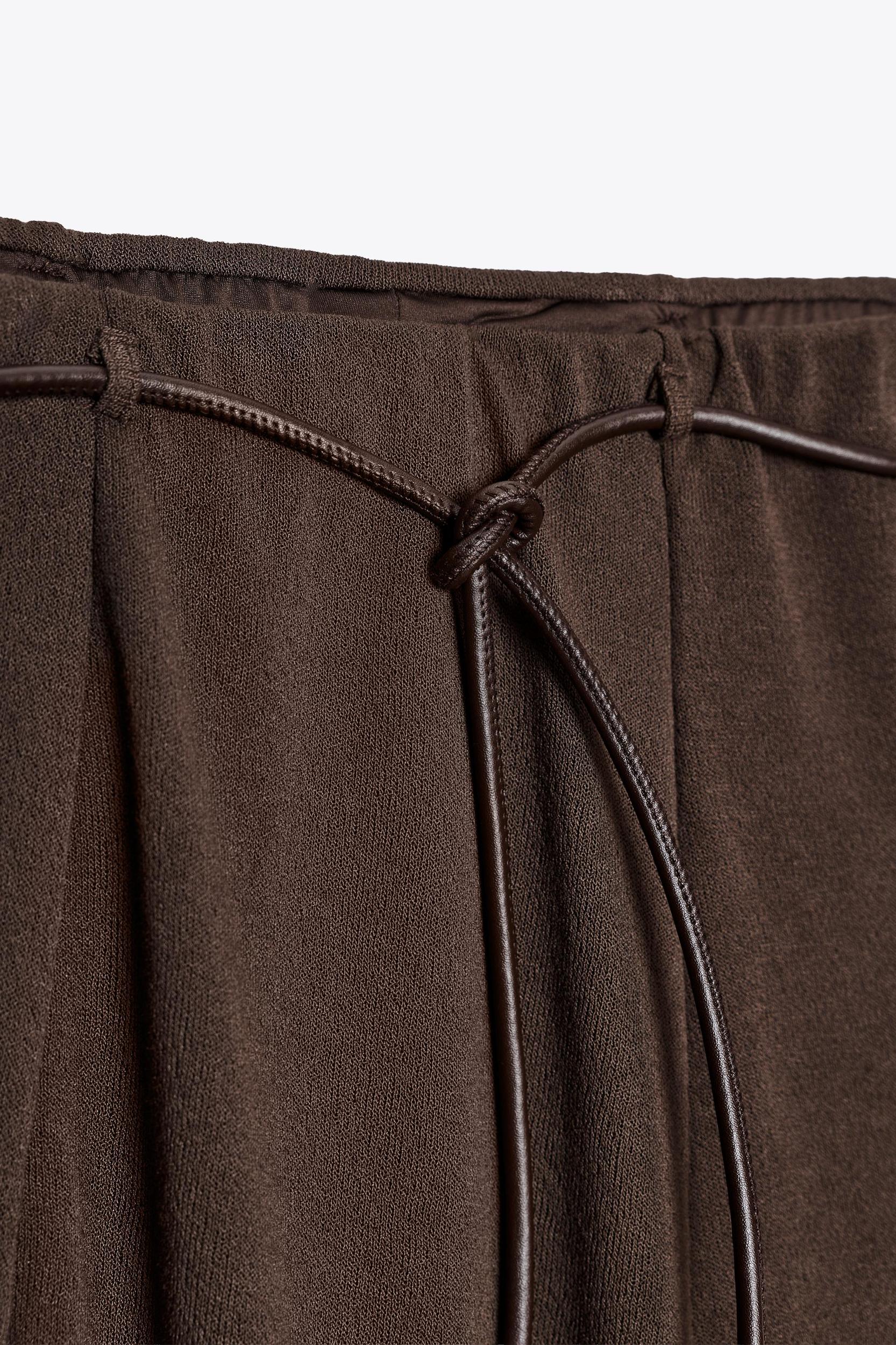 CUT-OUT KNIT SKIRT WITH BELT Product Image