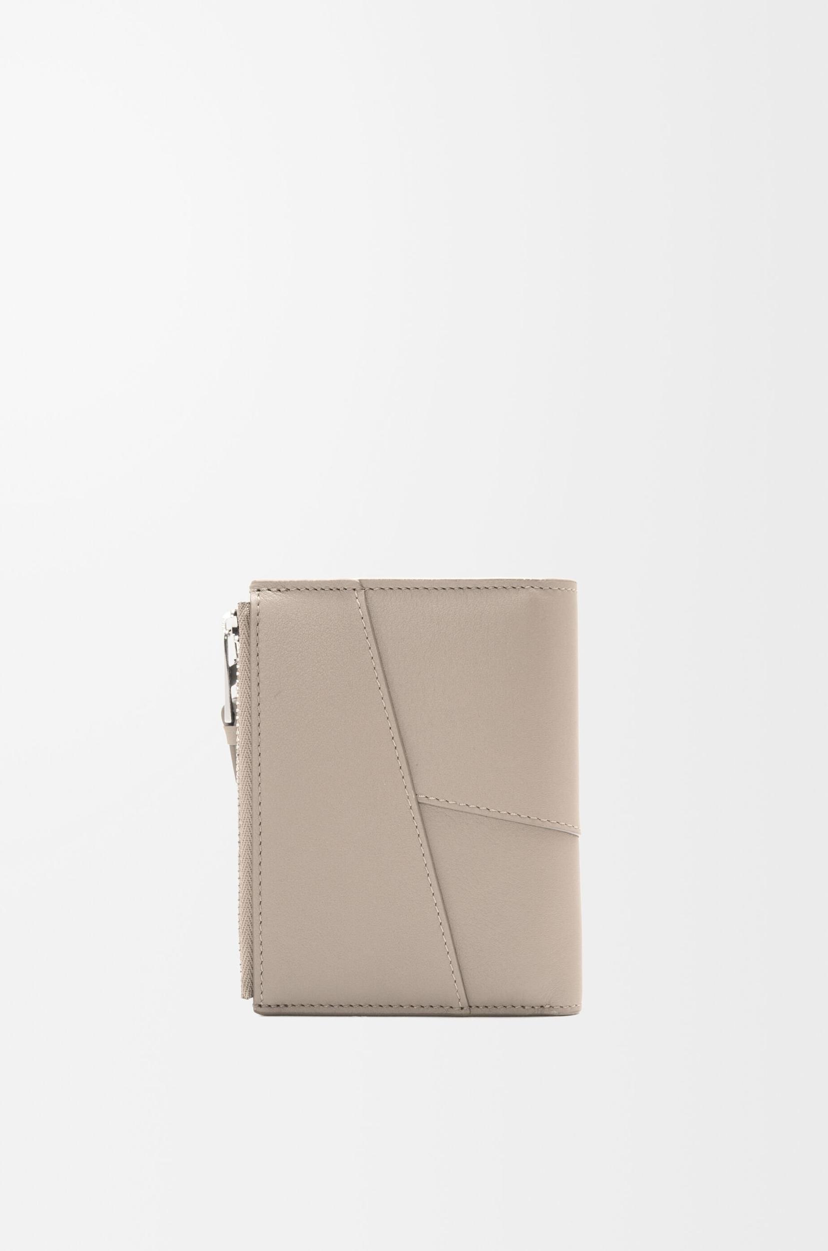 Puzzle slim compact wallet in classic calfskin Product Image