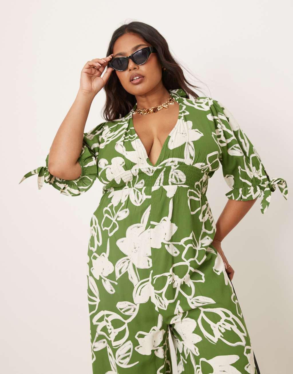 ASOS DESIGN Curve shirred waist jumpsuit in green floral print  Product Image