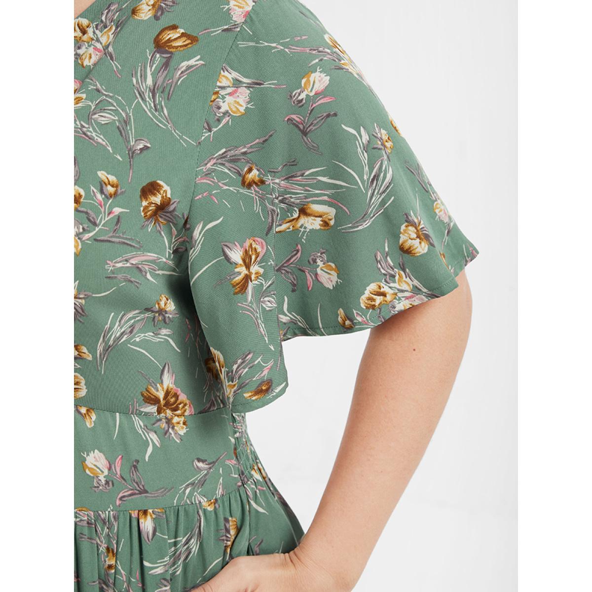 Plus Size Bloom Dress - Floral Flutter Shirred Pocket V Neck Dress Green Women Casual Gathered V-neck Short sleeve Curvy Midi Dress BloomChic 14-16/1X Product Image