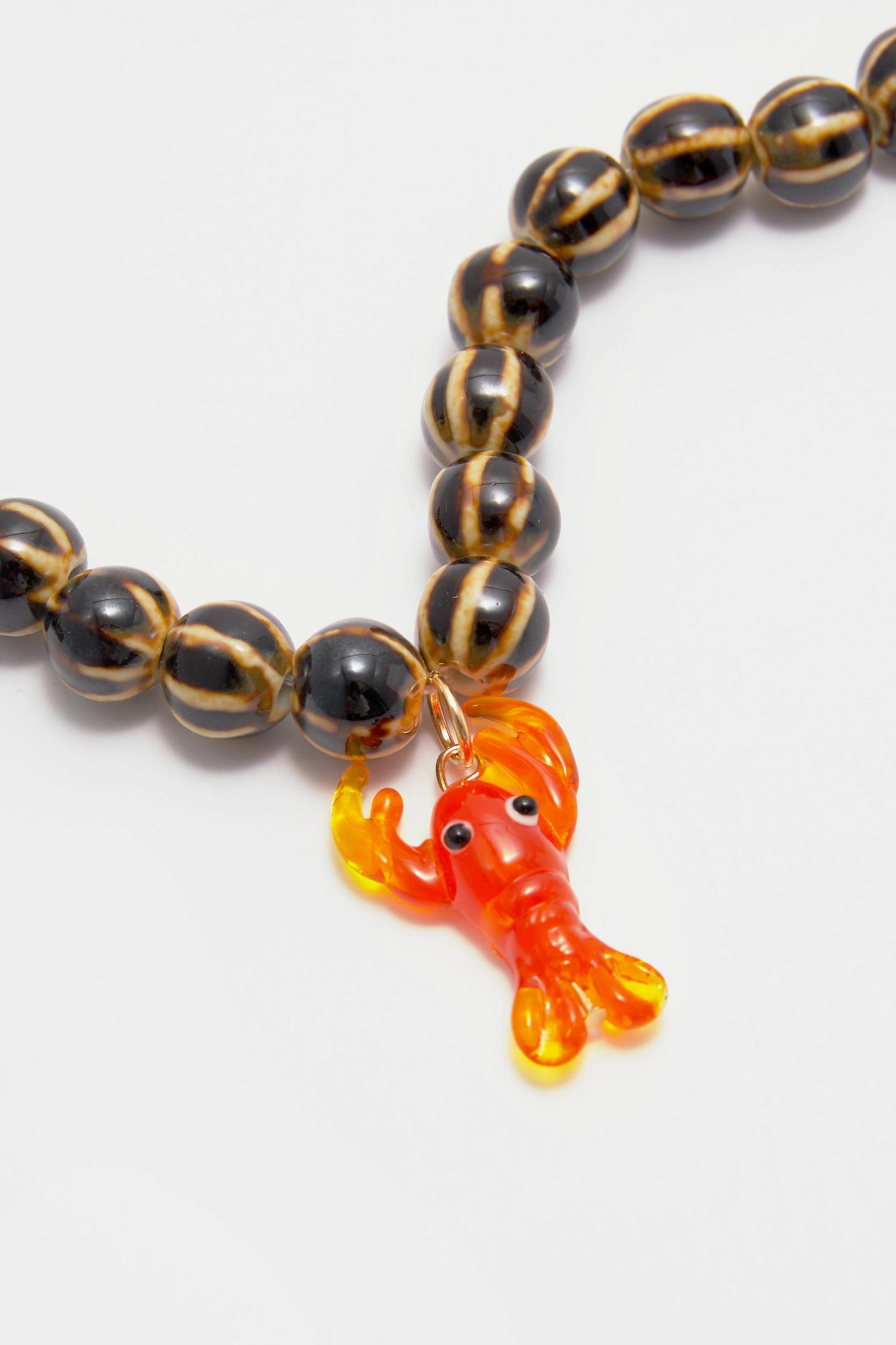 Beaded necklace with lobster pendant Product Image