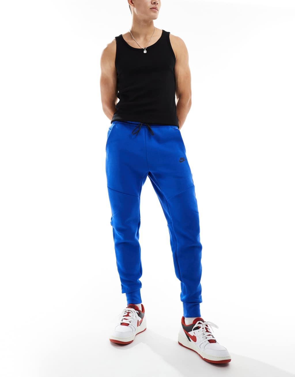 Nike Tech Fleece cuffed sweatpants in blue Product Image
