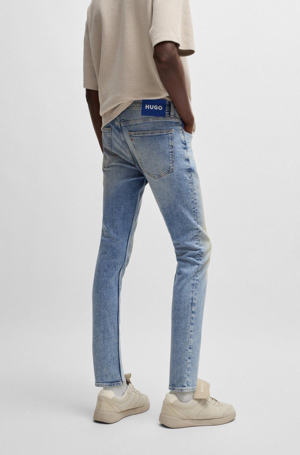 Extra-slim-fit jeans in stonewashed blue stretch denim Product Image
