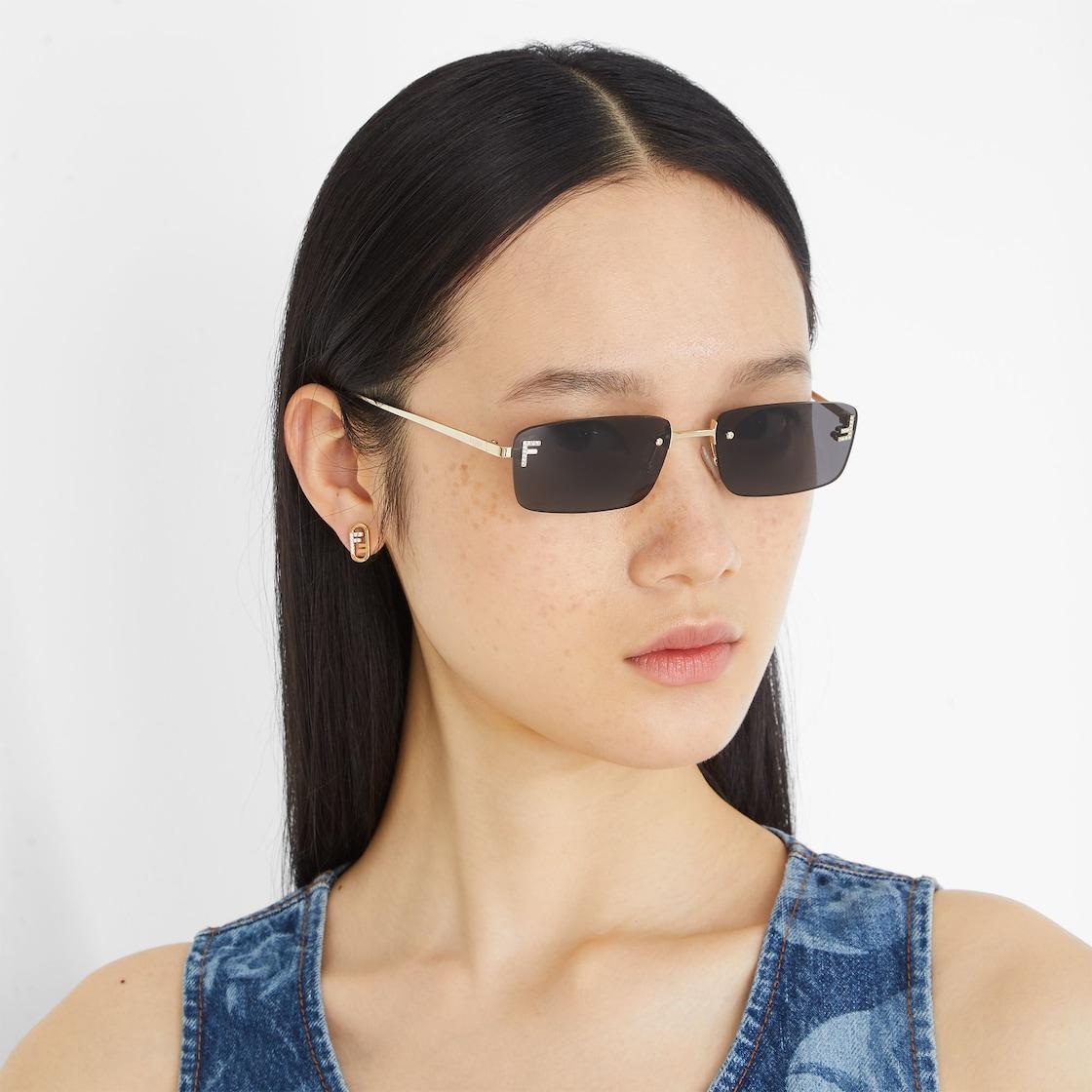 Fendi First CrystalGold-colored sunglasses with gray lenses Product Image